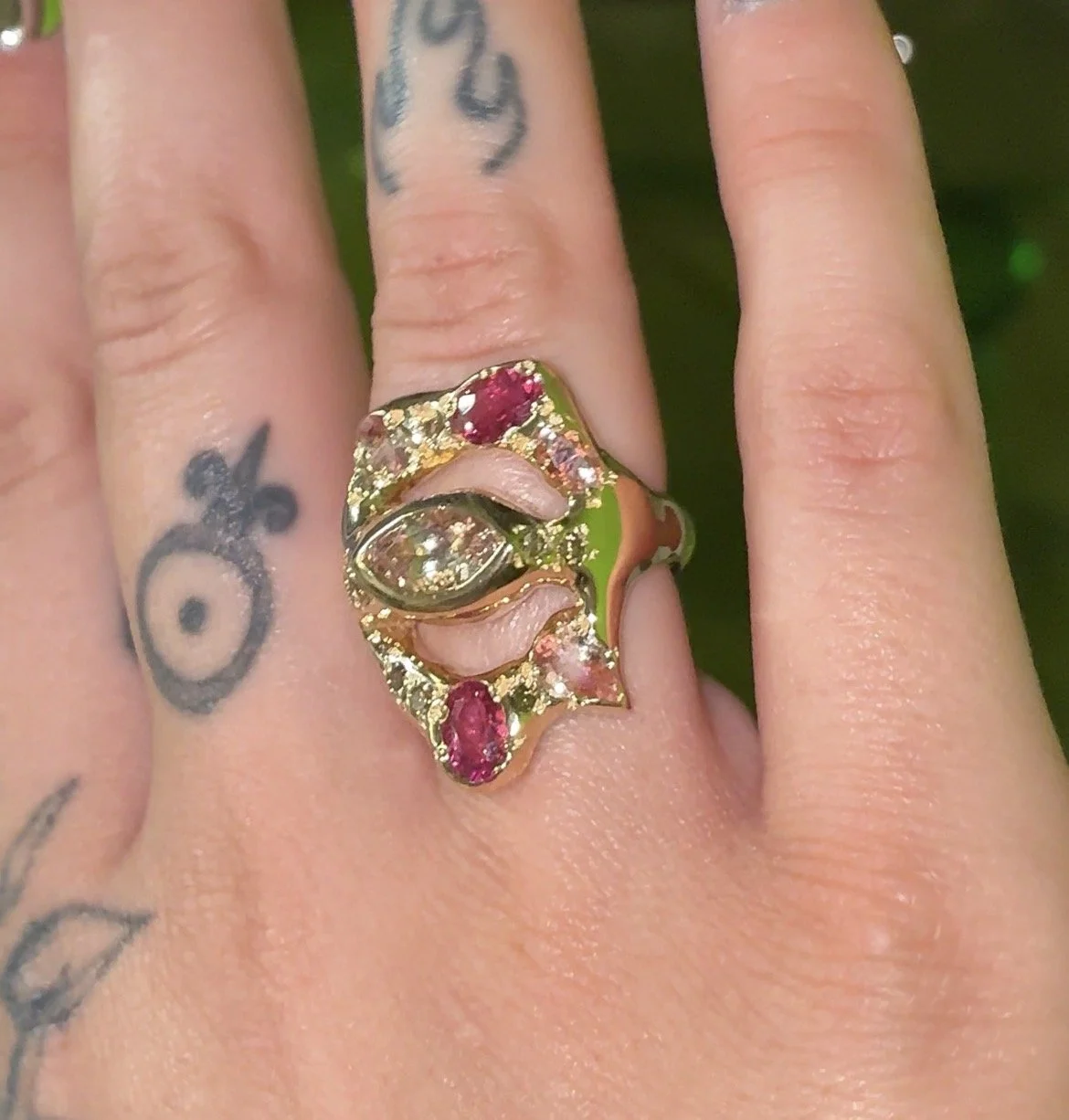 Saturn statement ring - a gold ring with pink tourmalines and brown diamonds