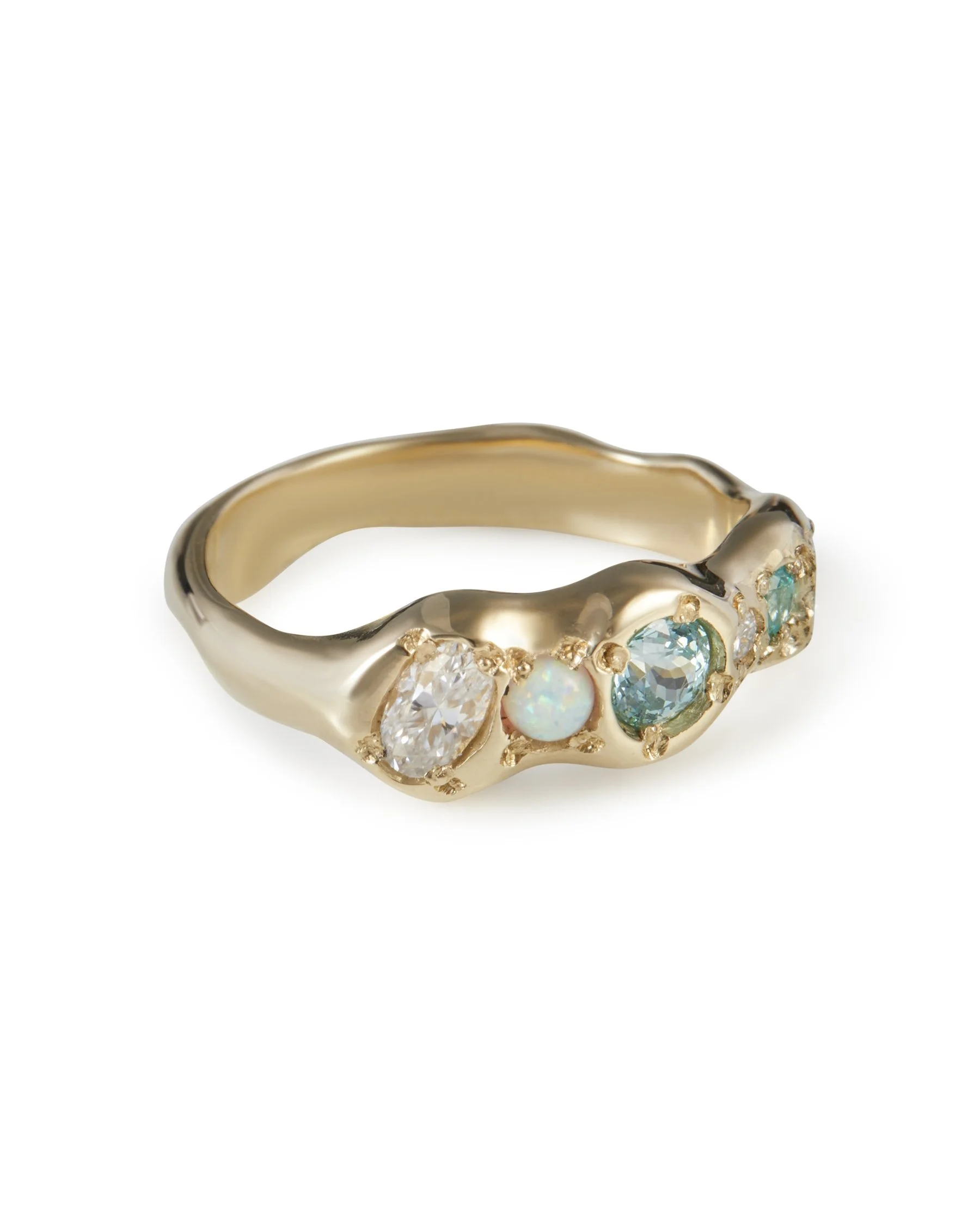 Angled view of Blue Sky Pointer Band Handmade with 9ct Gold Lab Grown Paraiba Garnet YAG, Lab Grown Moissanite, Synthetic Opal, Sky Blue Topaz gemstones