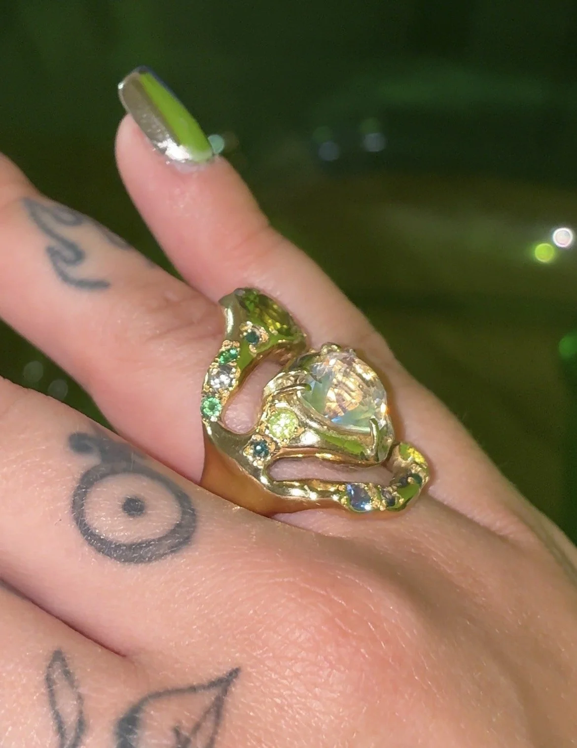 Earth Statement Ring - A 3 strand ring with a central heart moonstone and green and blue gemstones in gold