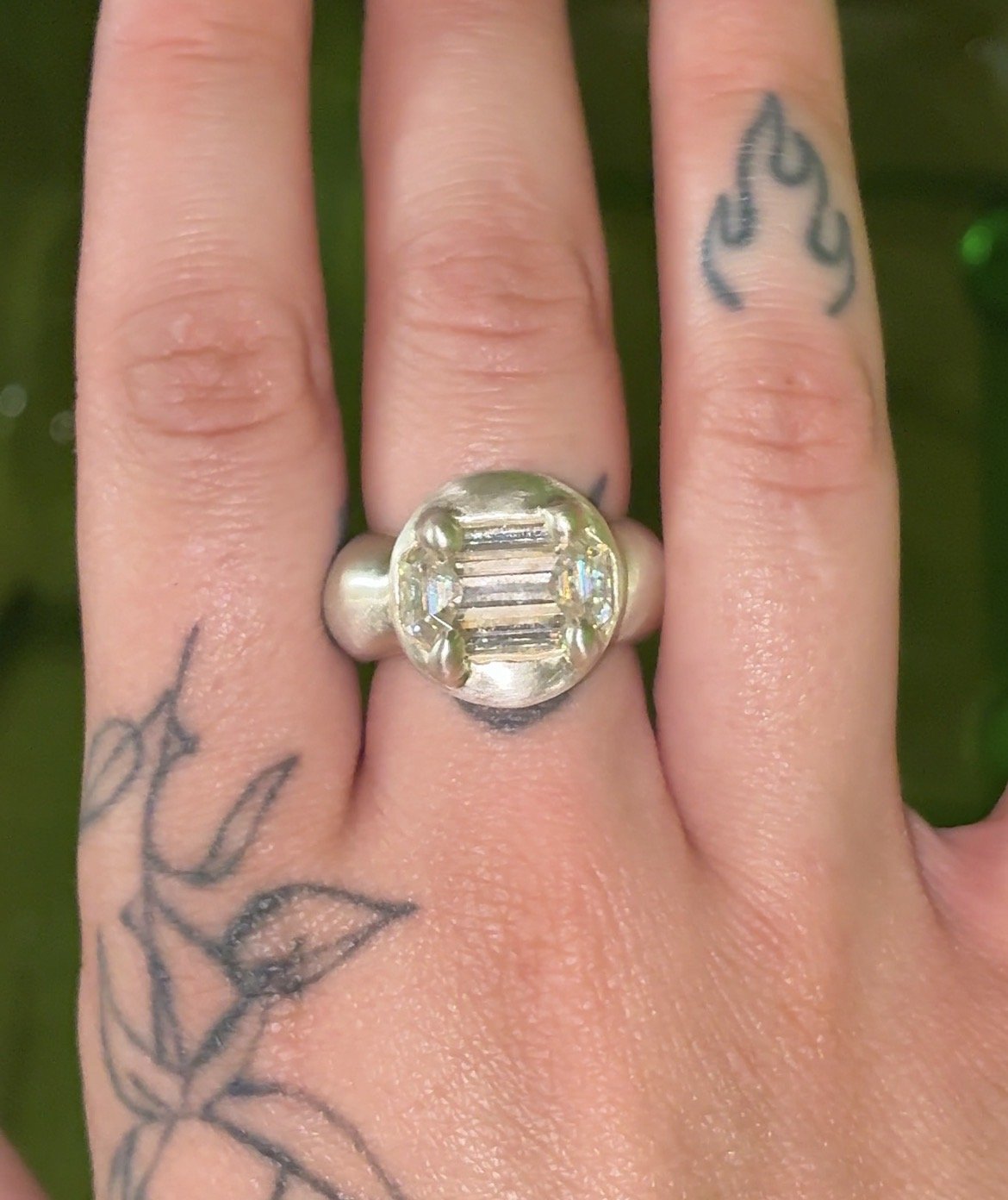 Uranus statement ring - a white gold puffy ring with an emerald cut moissanite in the centre