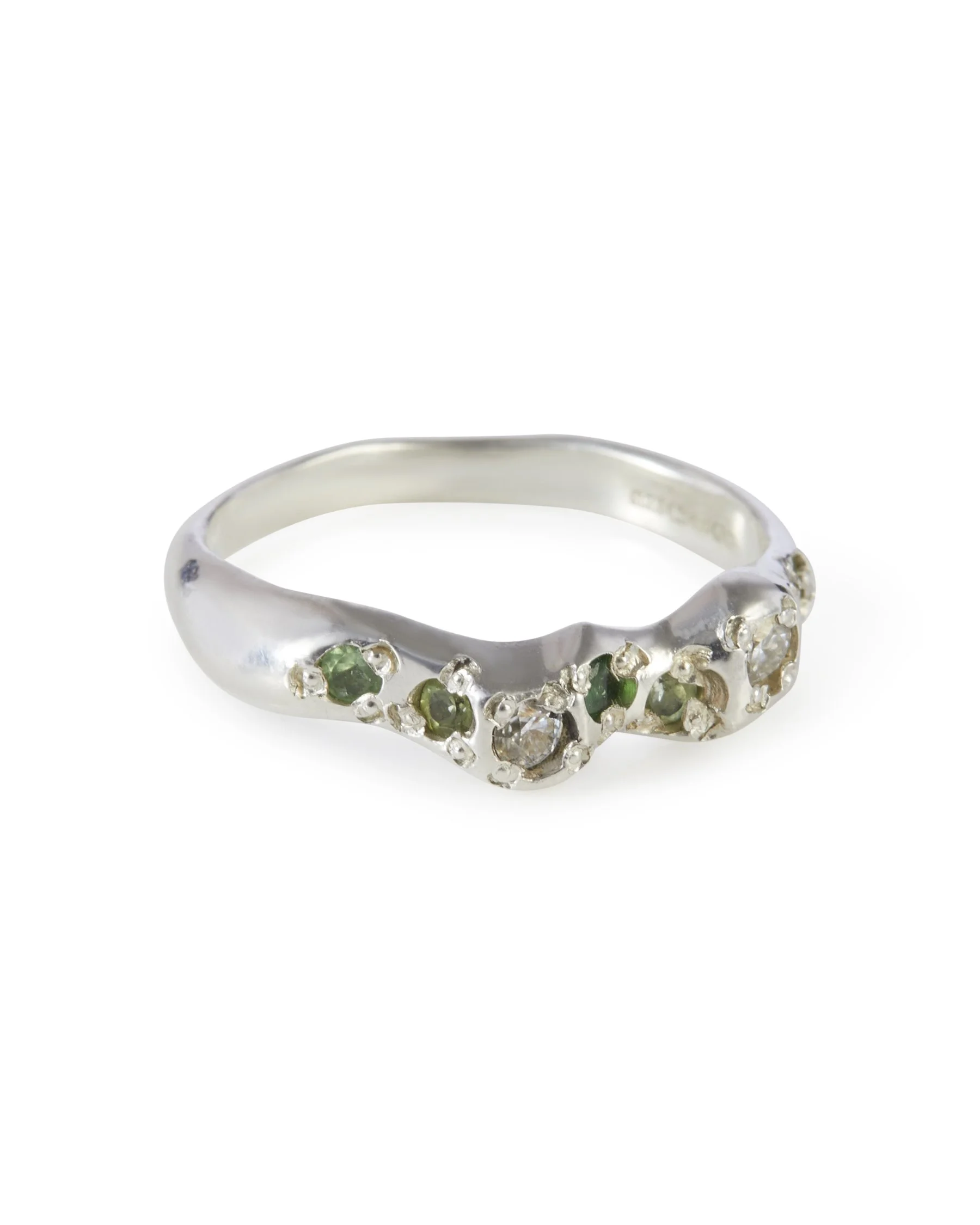 Angled view of the Leaf Green Mini Band, a sterling silver ring set with peridot, tsavorite garnet and moissanite.