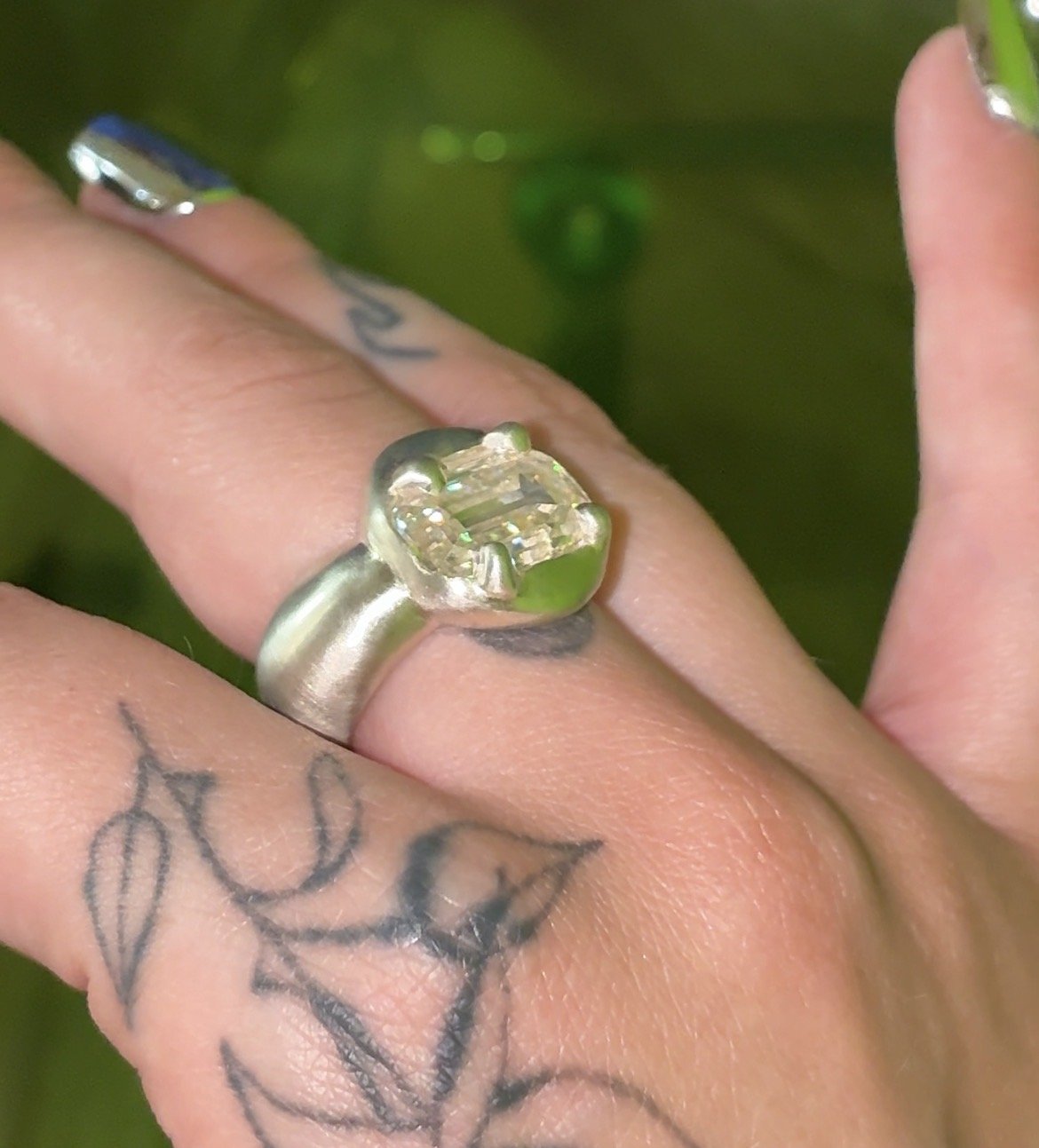 Uranus statement ring - a white gold puffy ring with an emerald cut moissanite in the centre