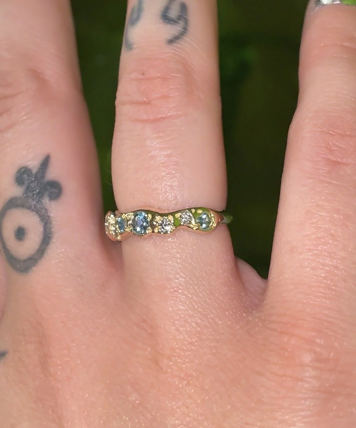 Uranus Ring gold - A molten gold ring with aquamarine and salt and pepper diamonds