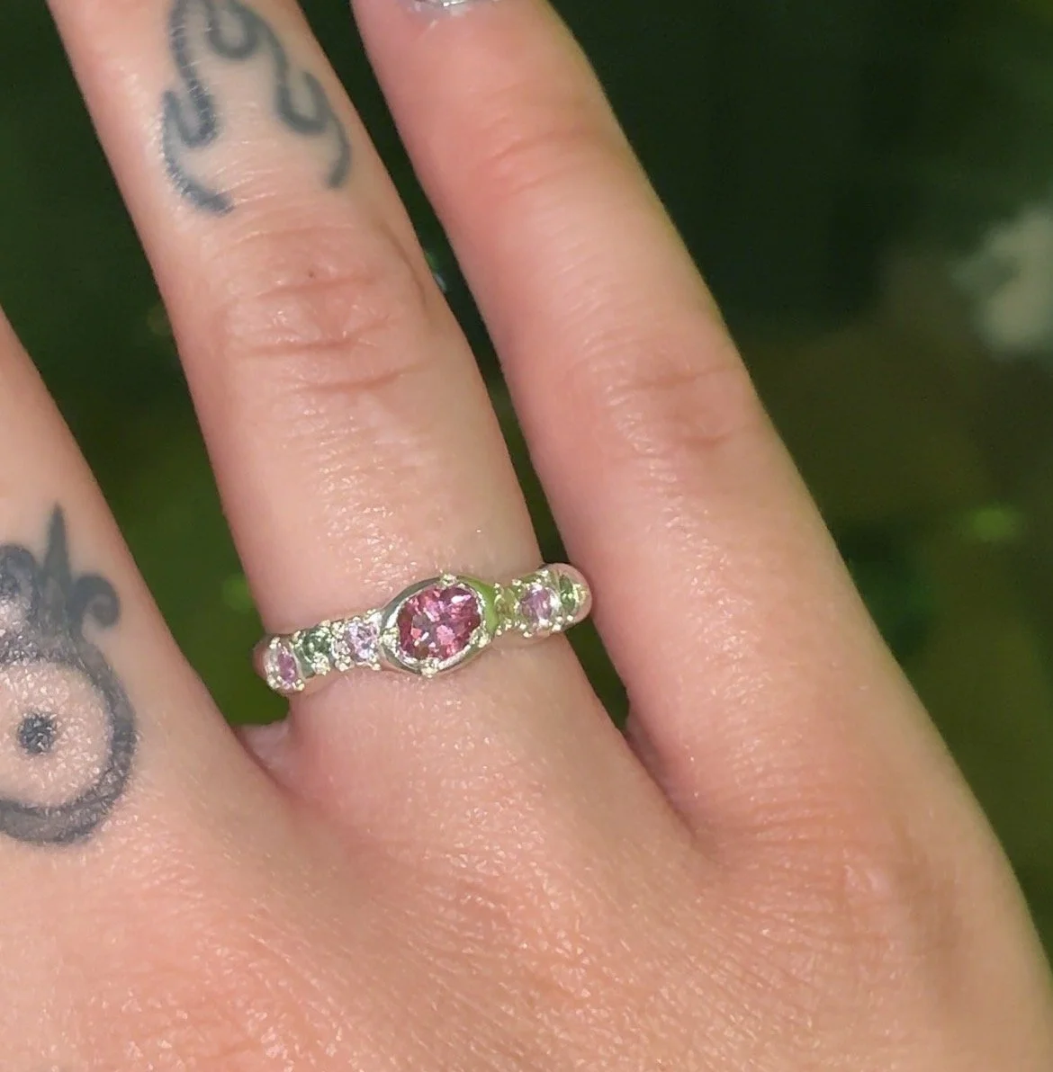 Venus silver band - a silver molten band with pink and green stones inspired by venus