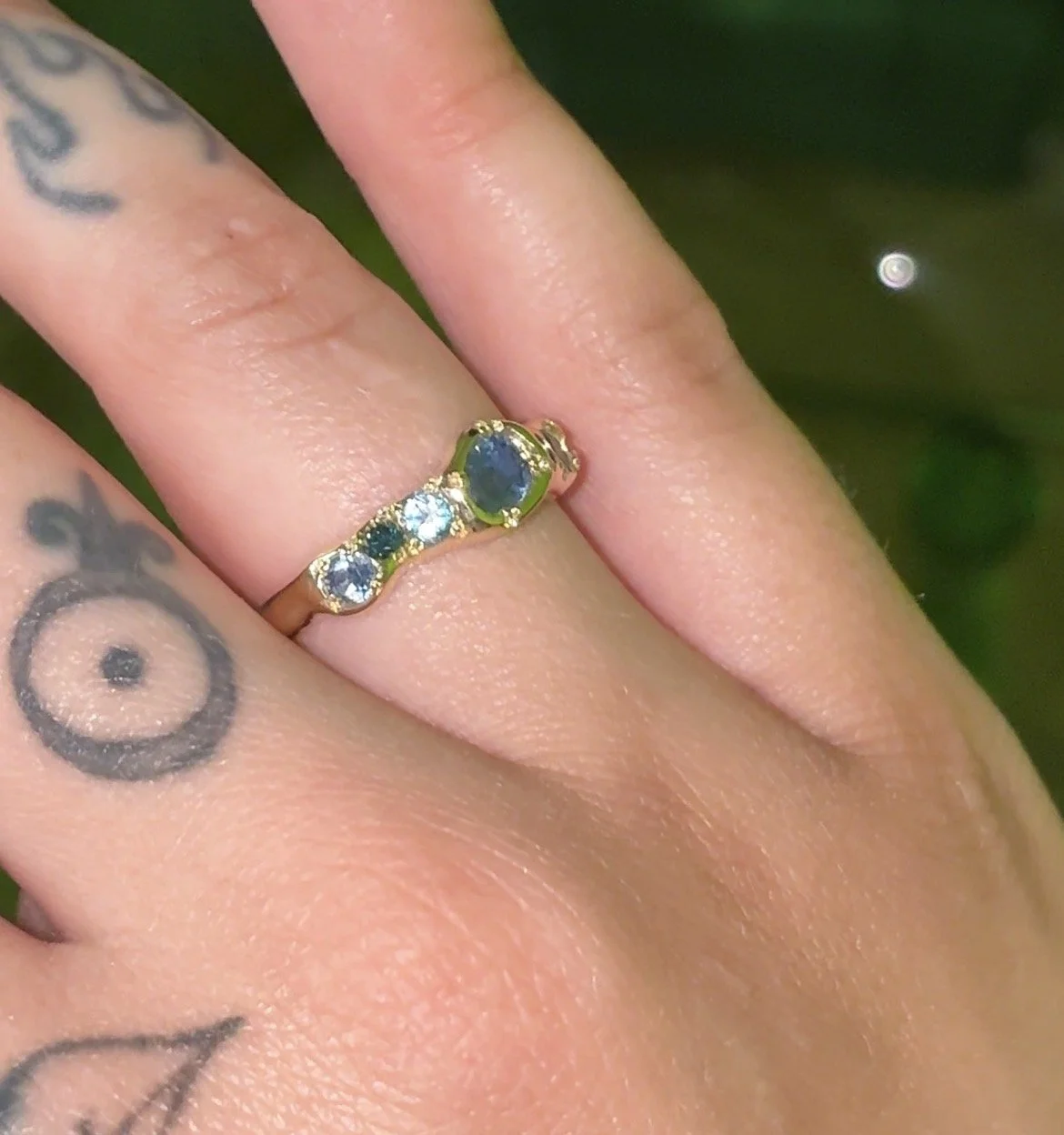 Neptune Band Gold - a gold molten band with blue diamonds, topaz and sapphire