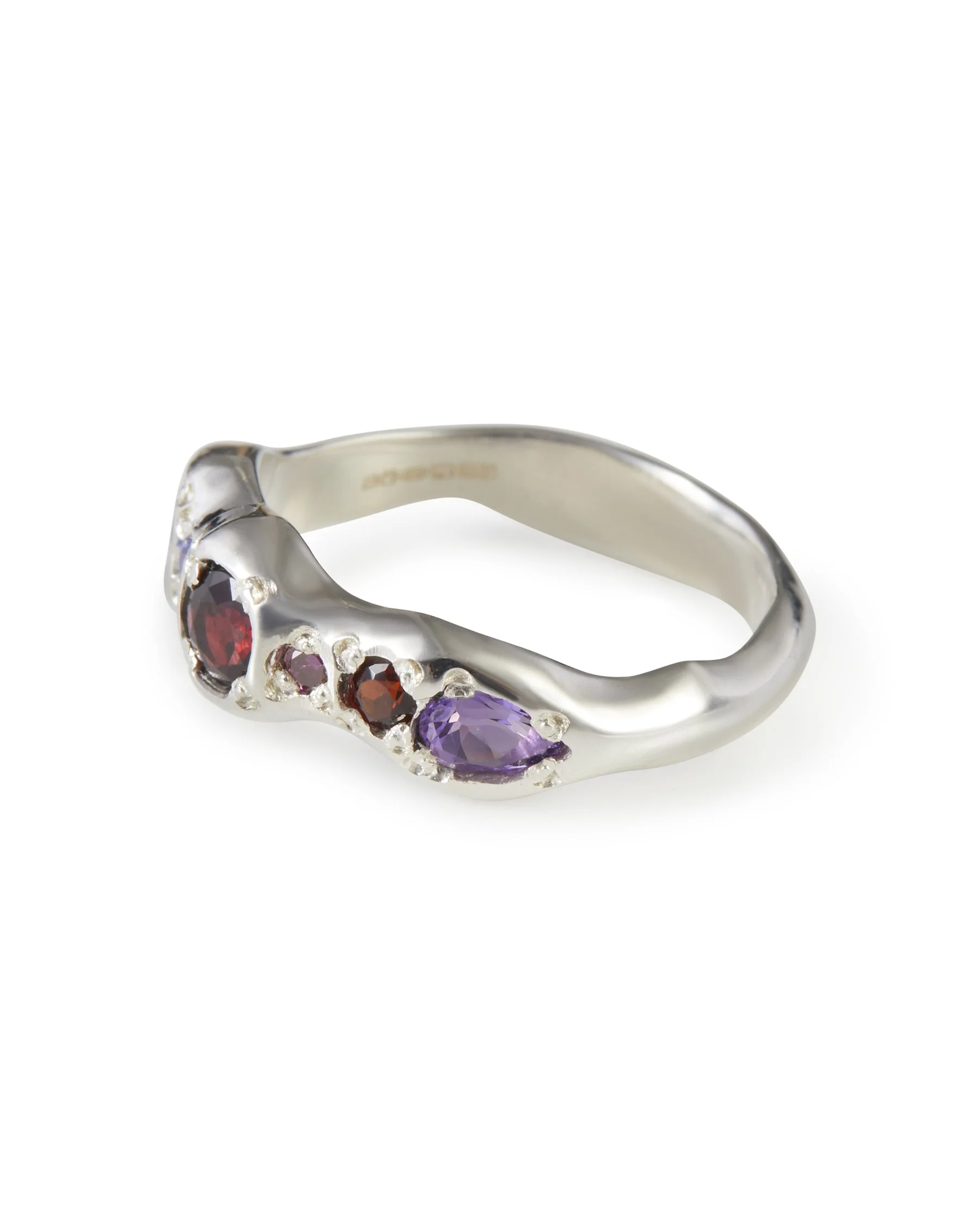 Side profile of the Gemma Pointer Band in sterling silver with garnet, tanzanite and mixed gemstones.