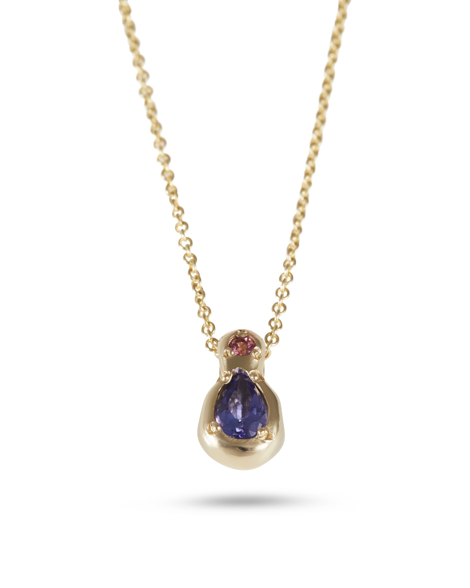 A yellow gold pear shaped pendant with blue and pink stones on a chain
