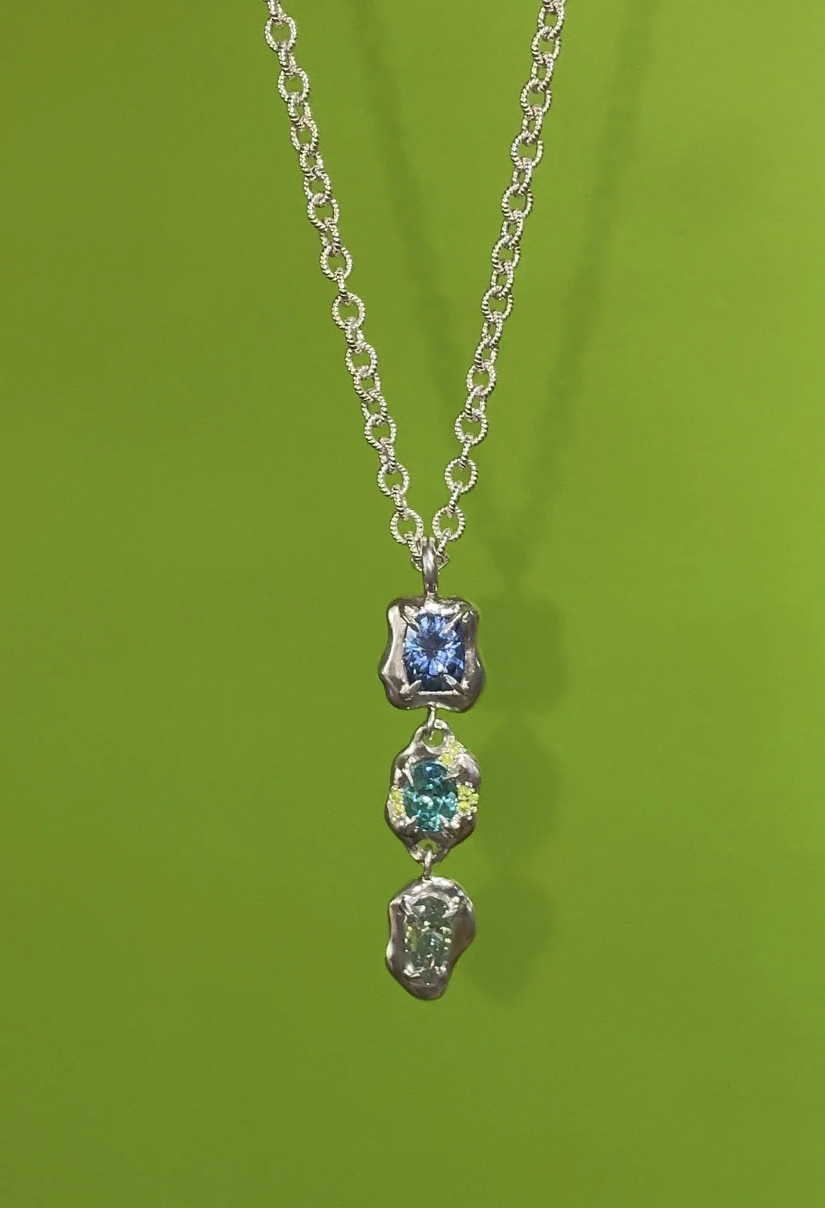 Neptune Necklace silver - A 3 tier necklace on a chain with a rope motif, with blue gemstones