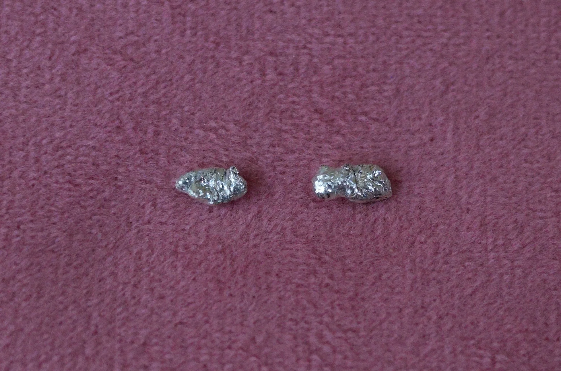 Textured sterling silver studs. The studs are mismatched