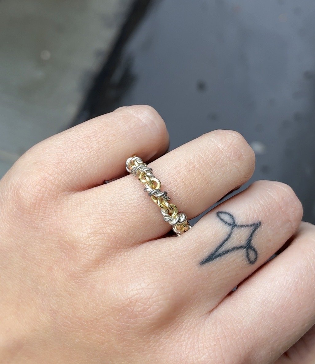two colour rope ring on hand