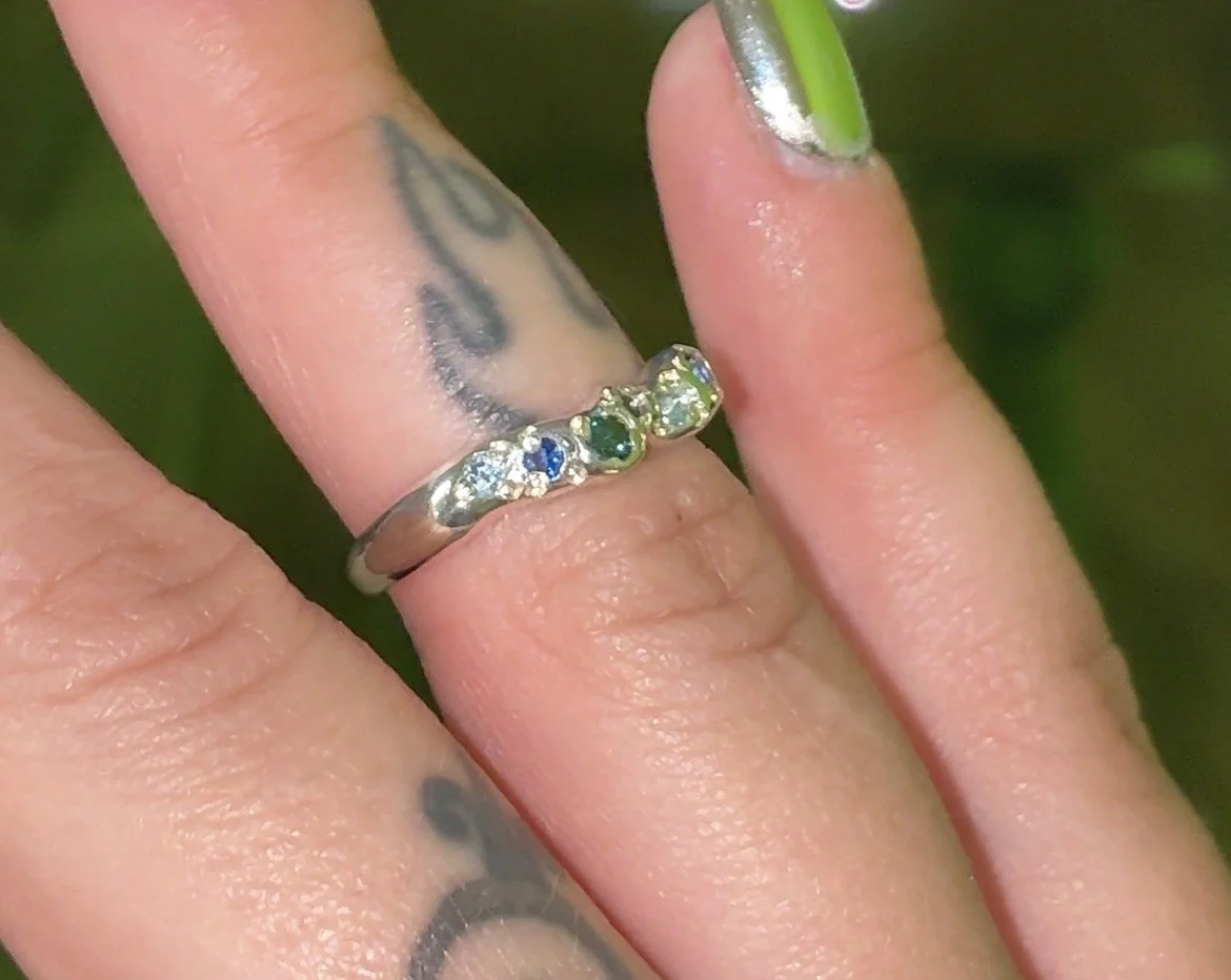 Neptune band silver - A silver molten band with blue topaz, blue diamonds and blue sapphire