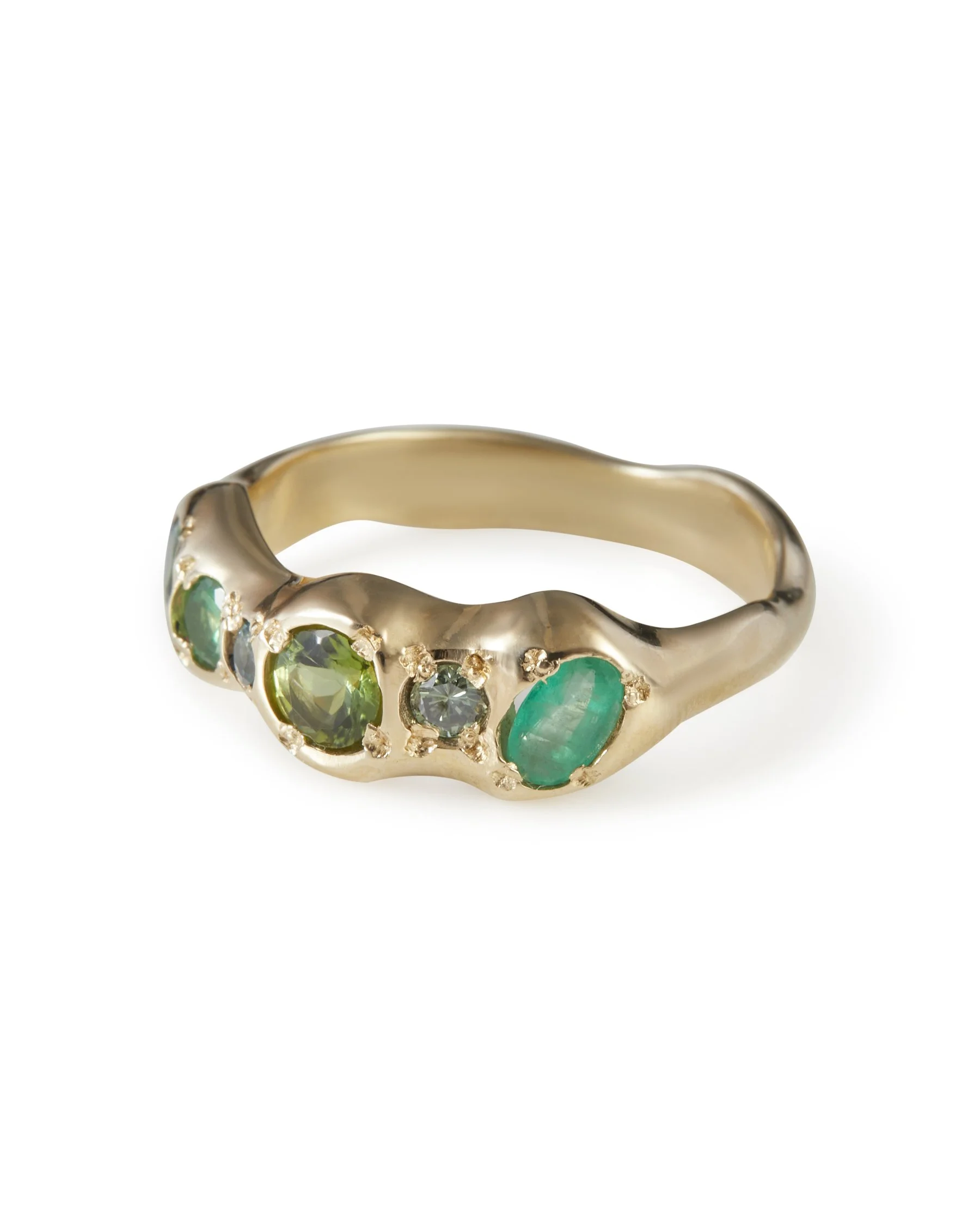 Angled view of the Pickle Pointer Band featuring green gemstones in 9ct yellow gold.