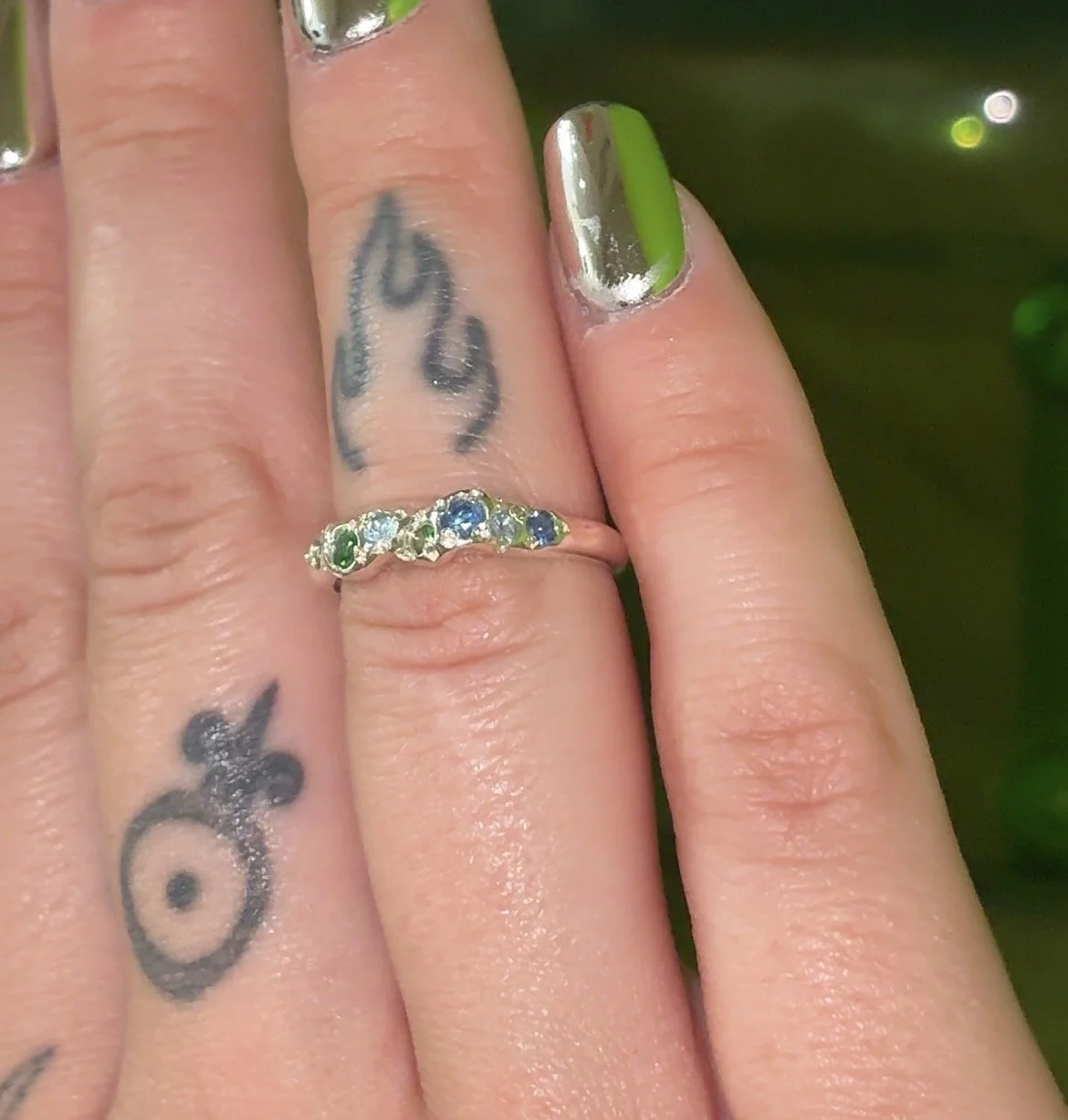 Earth silver ring - a molten silver band with blue and green gemstones
