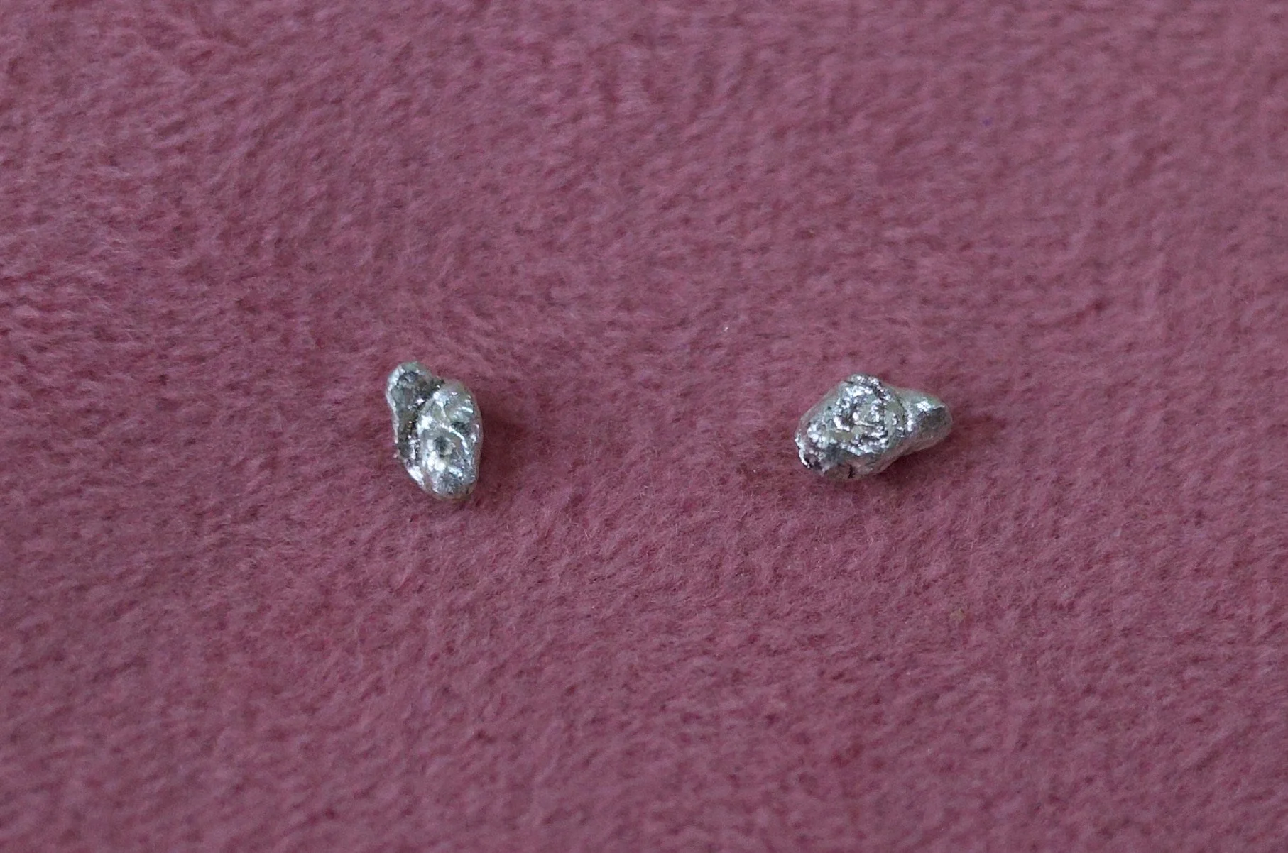 Textured sterling silver studs. The studs are mismatched