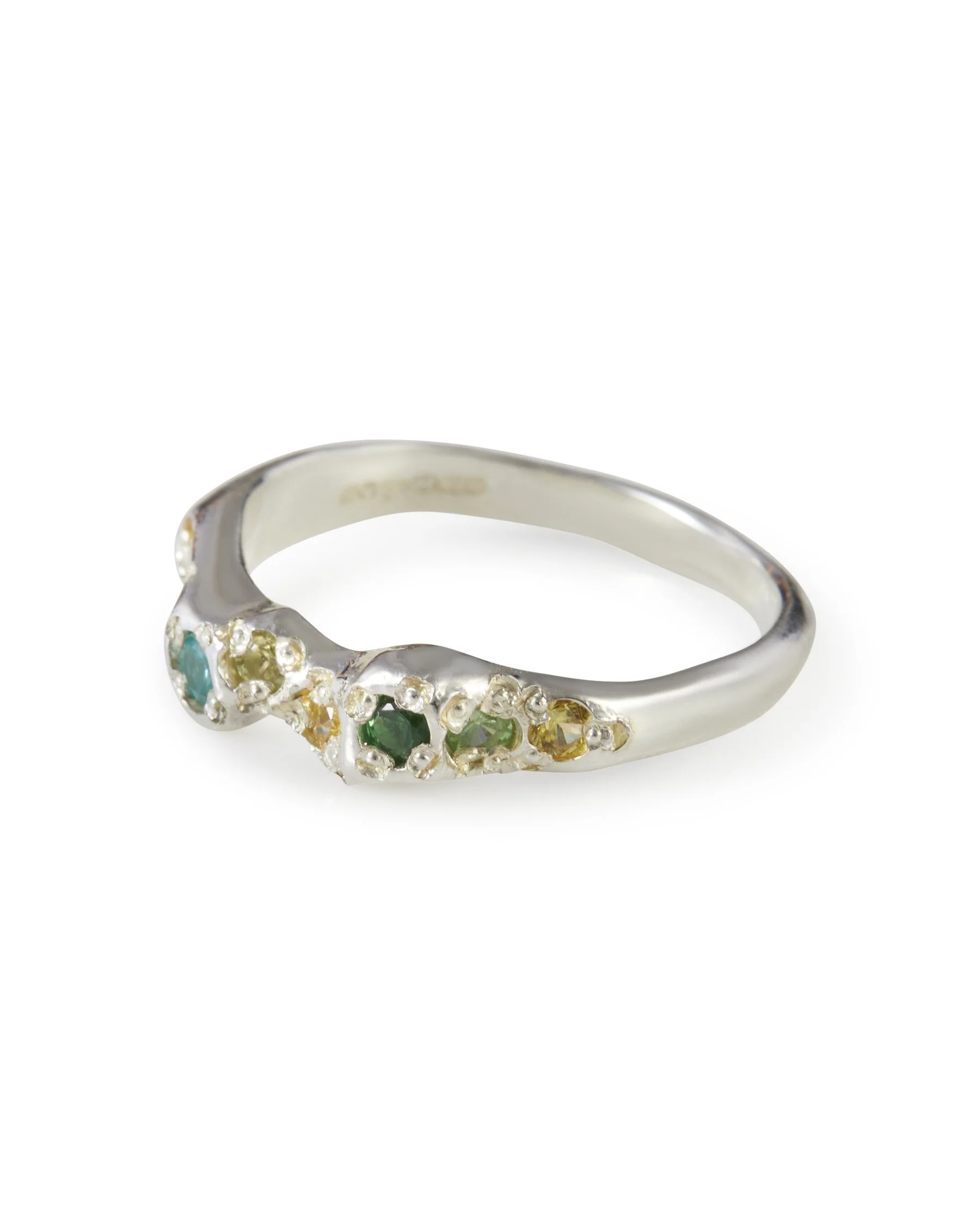 Side view of the Miami Mini Band featuring emerald, peridot, tsavorite garnet, yellow sapphire and paraiba YAG.