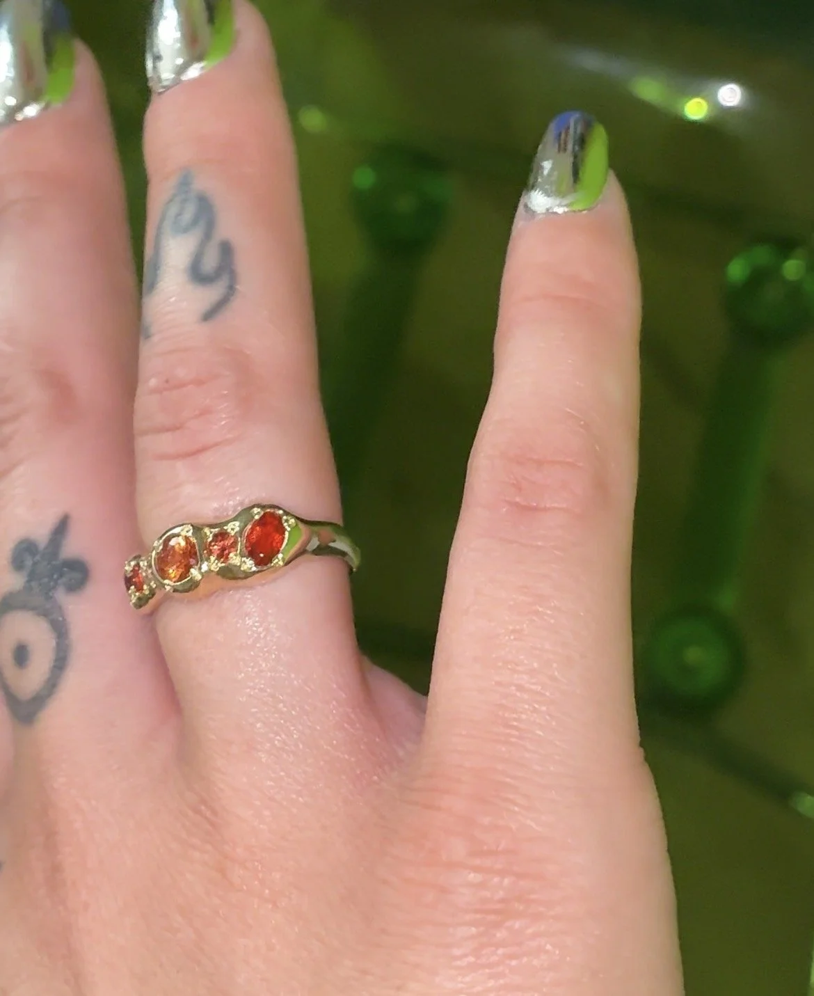 Mars Band Gold - A yellow gold molten band with orange sapphires and fire opal