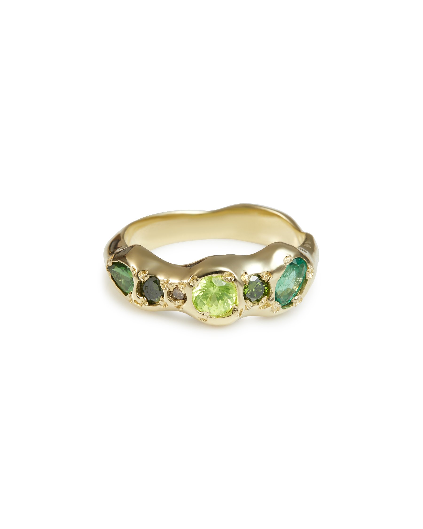 A  gold molten ring with green and brown stones on a white background