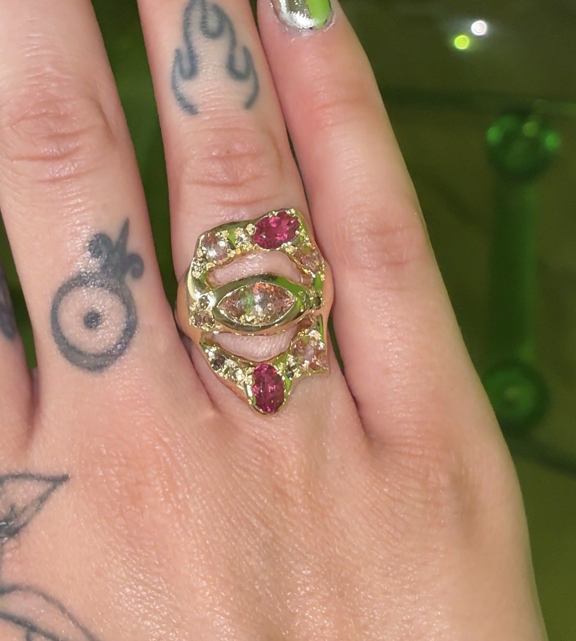 Saturn statement ring - a gold ring with pink tourmalines and brown diamonds