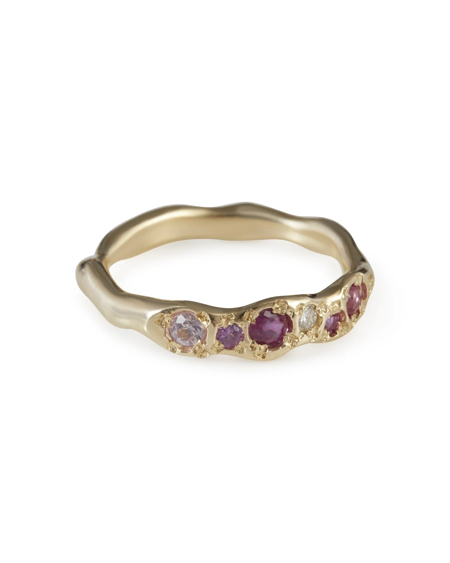 Angled view of the July Colne Ring featuring pink sapphire and moissanite in 9ct yellow gold.