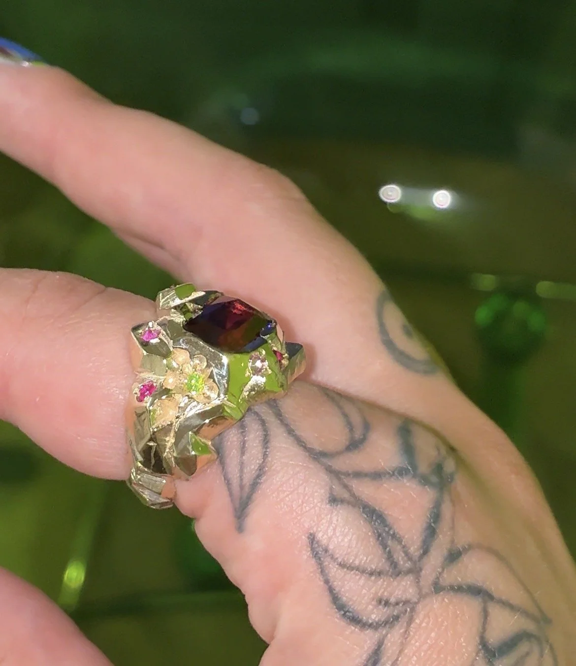 Mars statement ring - a heavily textured ring with garnet, sapphire and luag