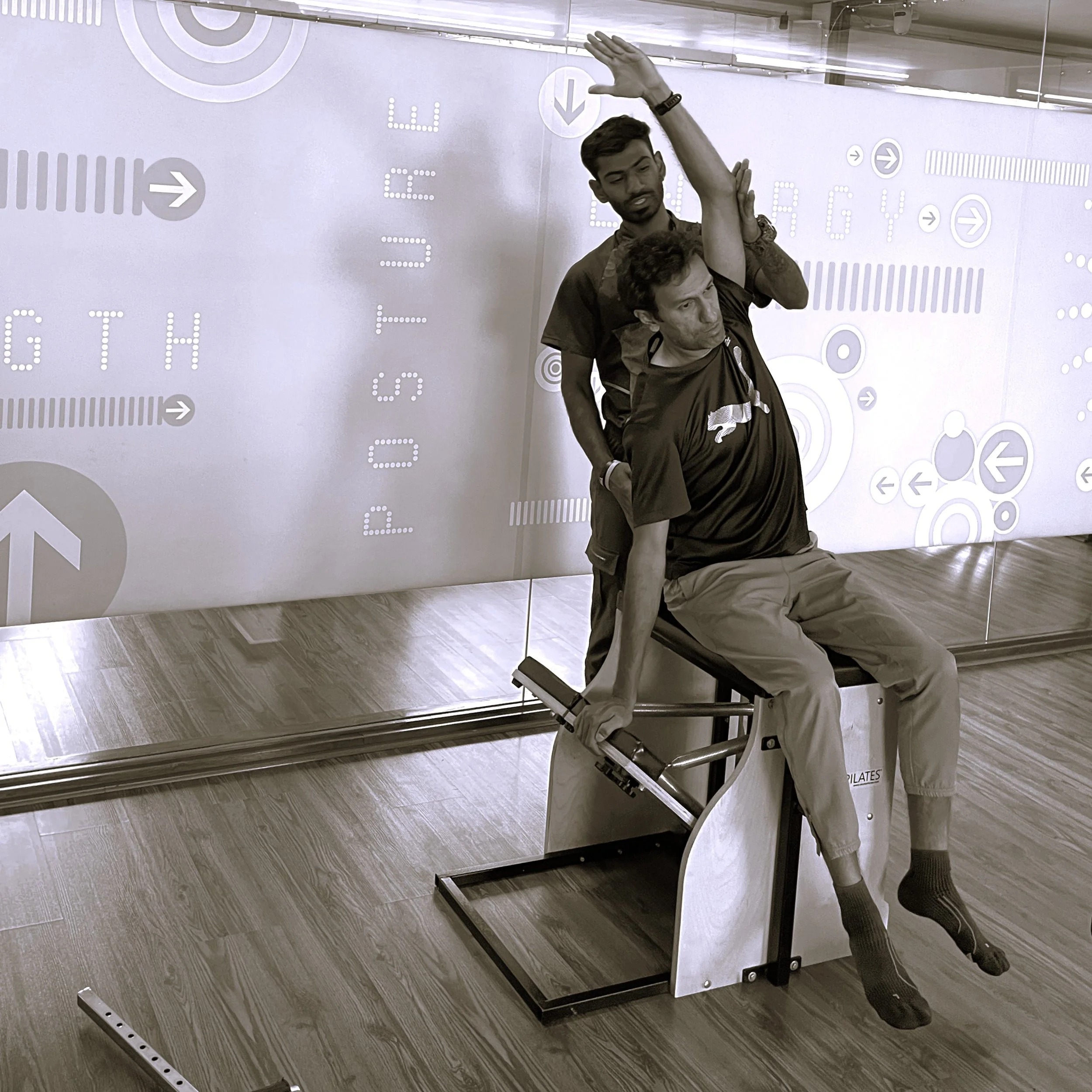 Instructor training client on the Pilates Chair