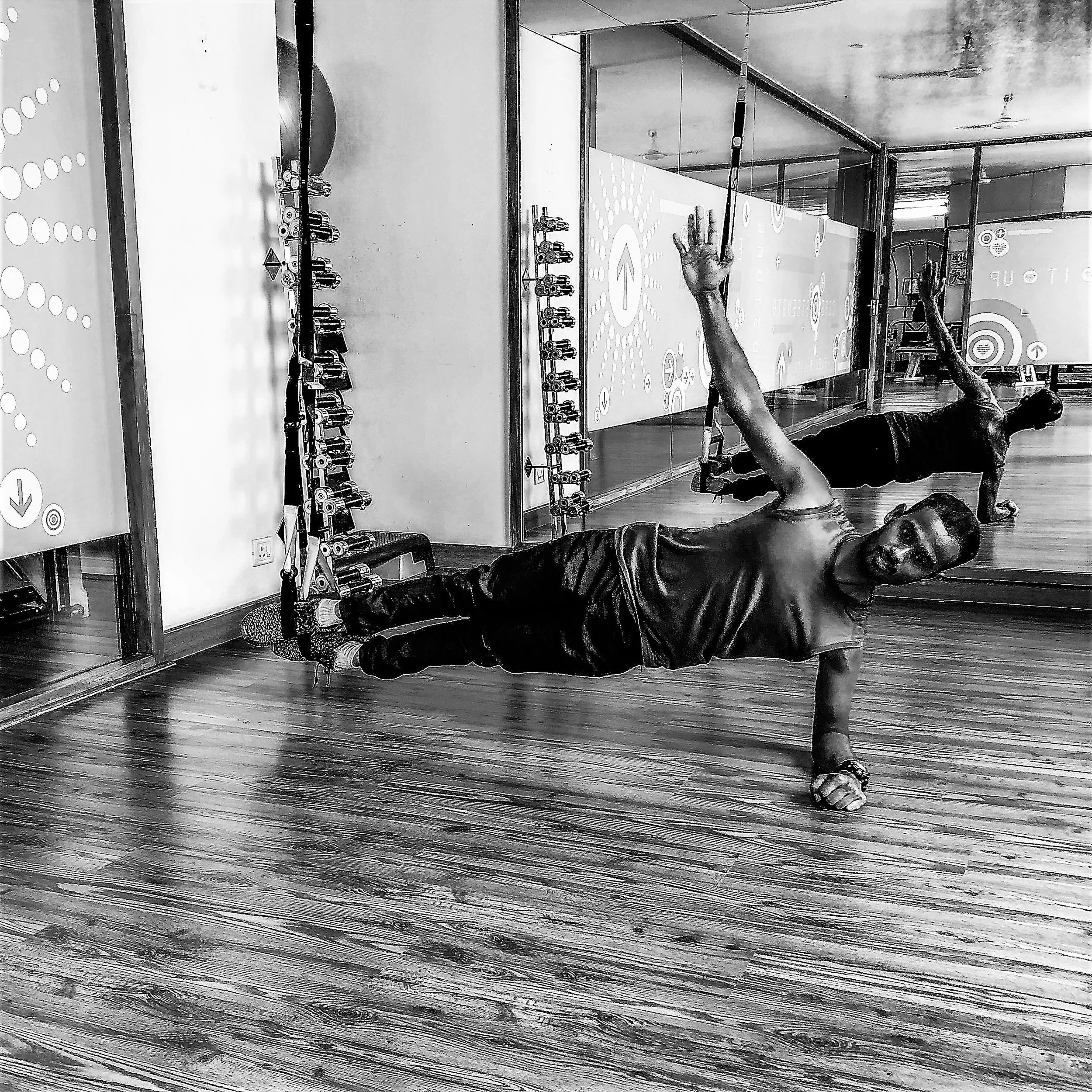 Plank exercises with TRX suspension straps for core strength and stability, The Zone Bangalore