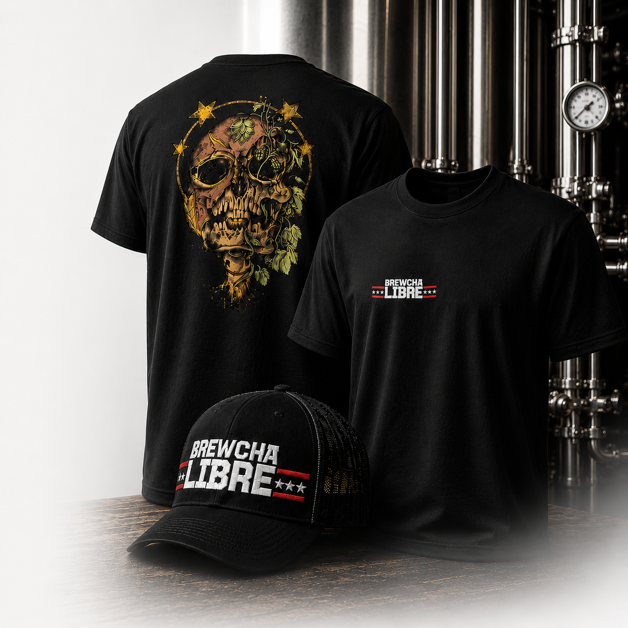 Black t-shirts with 'BREWCHA LIBRE' logo, a black cap with the same logo, and a backdrop of industrial pipes.