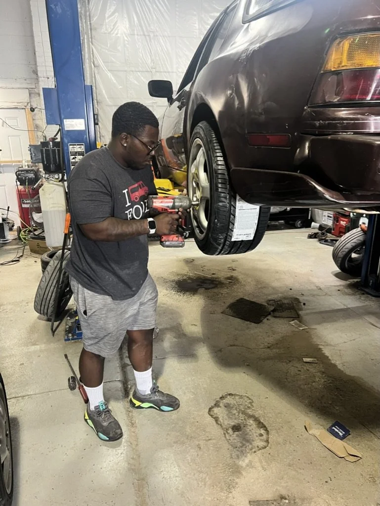 Qualeak putting some new tires on the Yeti.