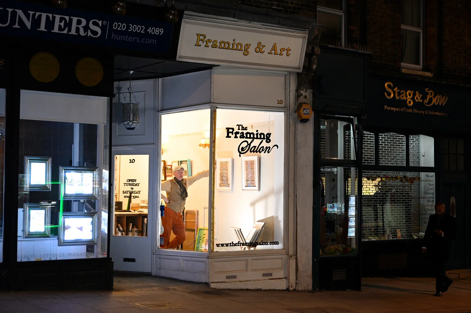 man-looking-out-window-of-framing-shop.jpg