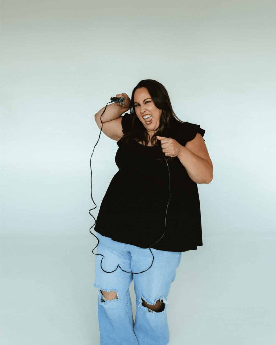 fun makeup artist using hair tools