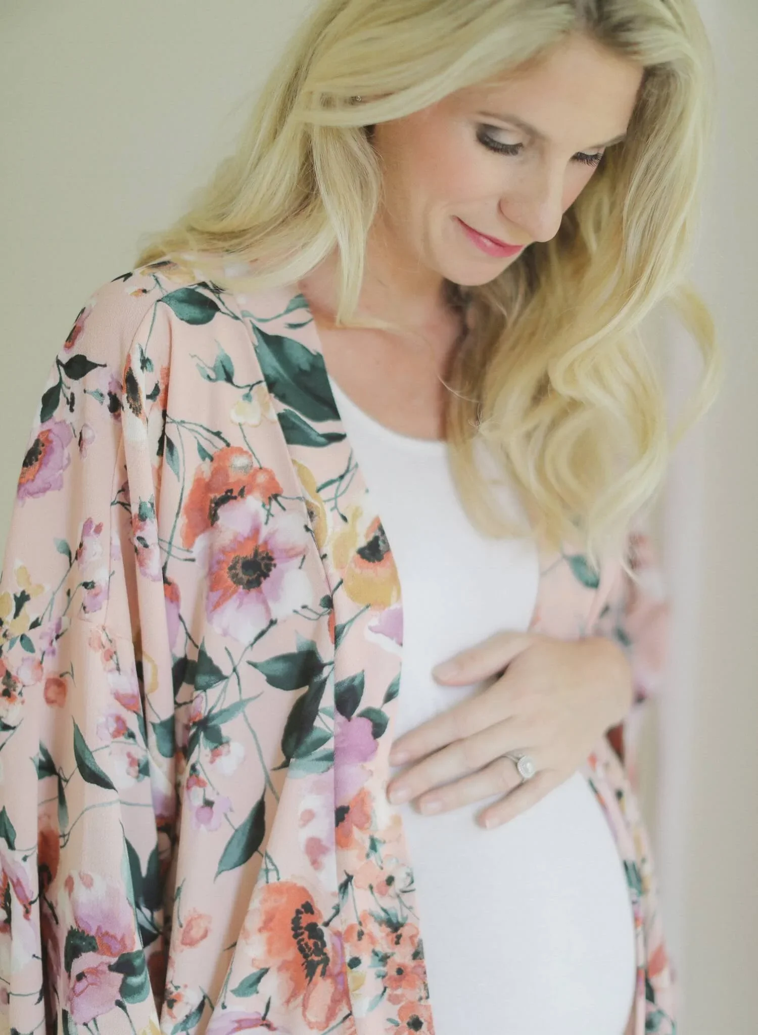 woman holding her baby bump