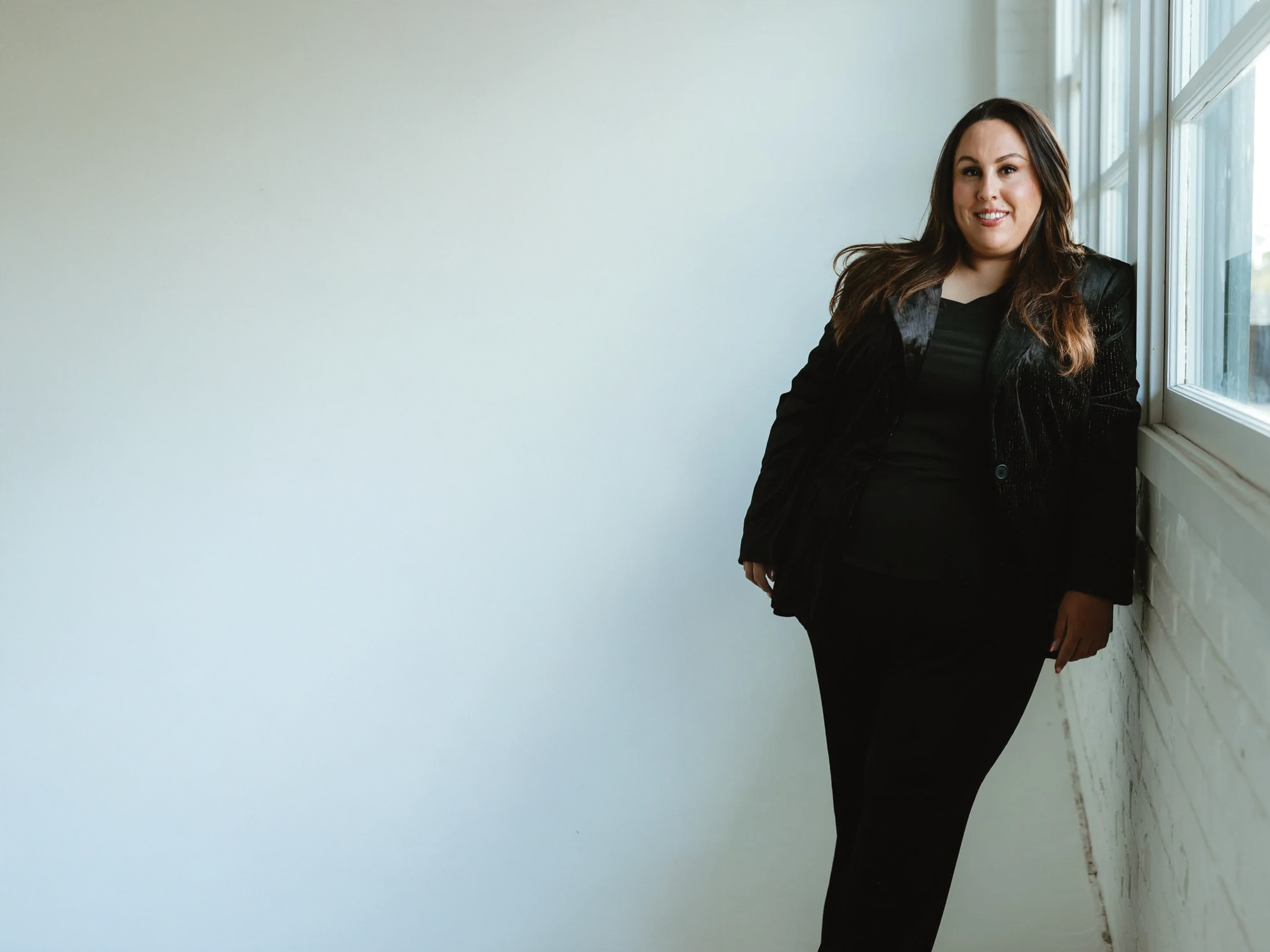 makeup artist wearing all black looking chic and polished