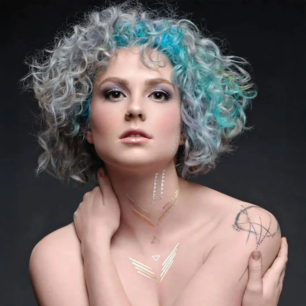 Bold makeup look, smokey eyes on a model with blue hair