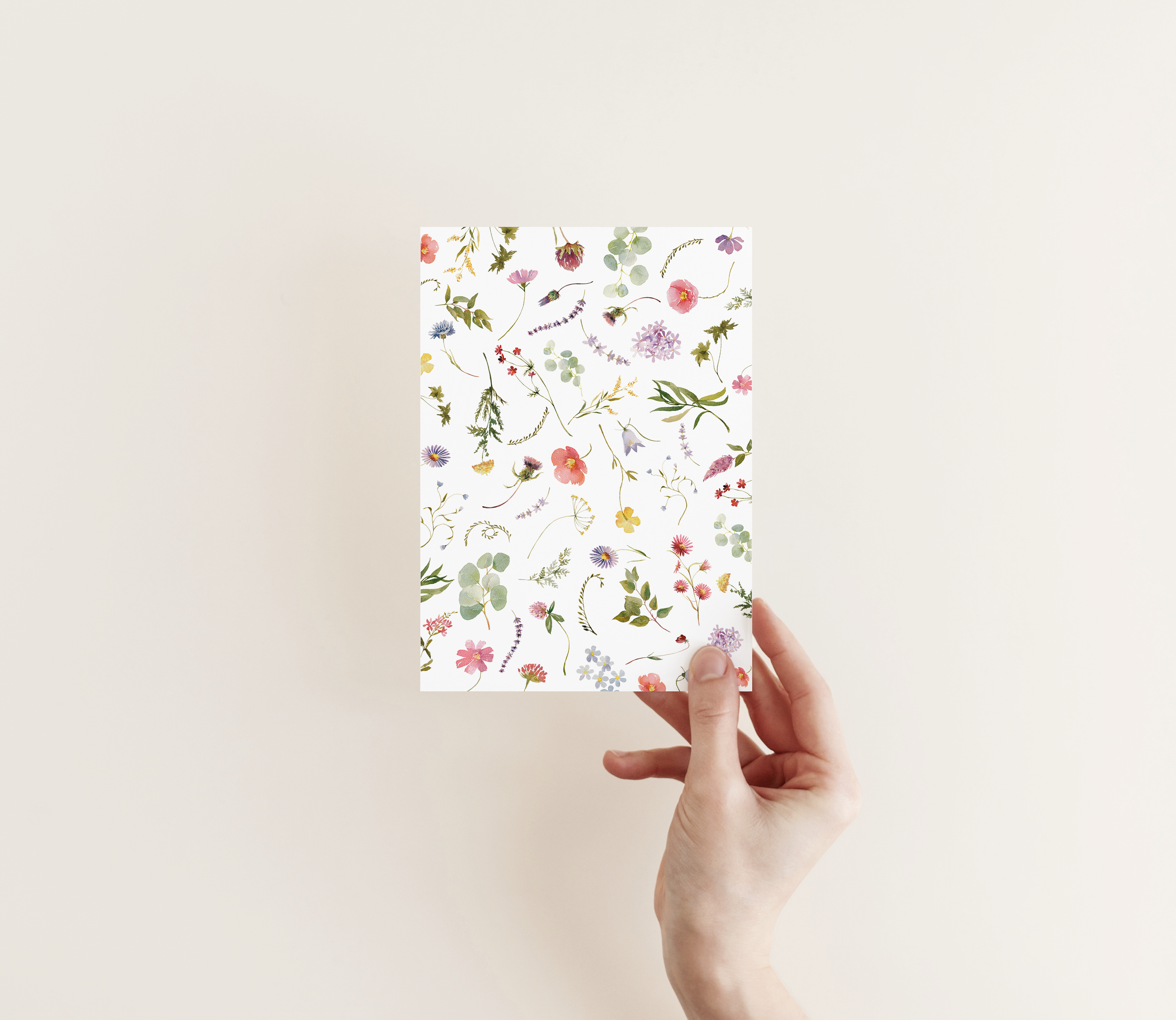 wildflower wedding stationery in hand