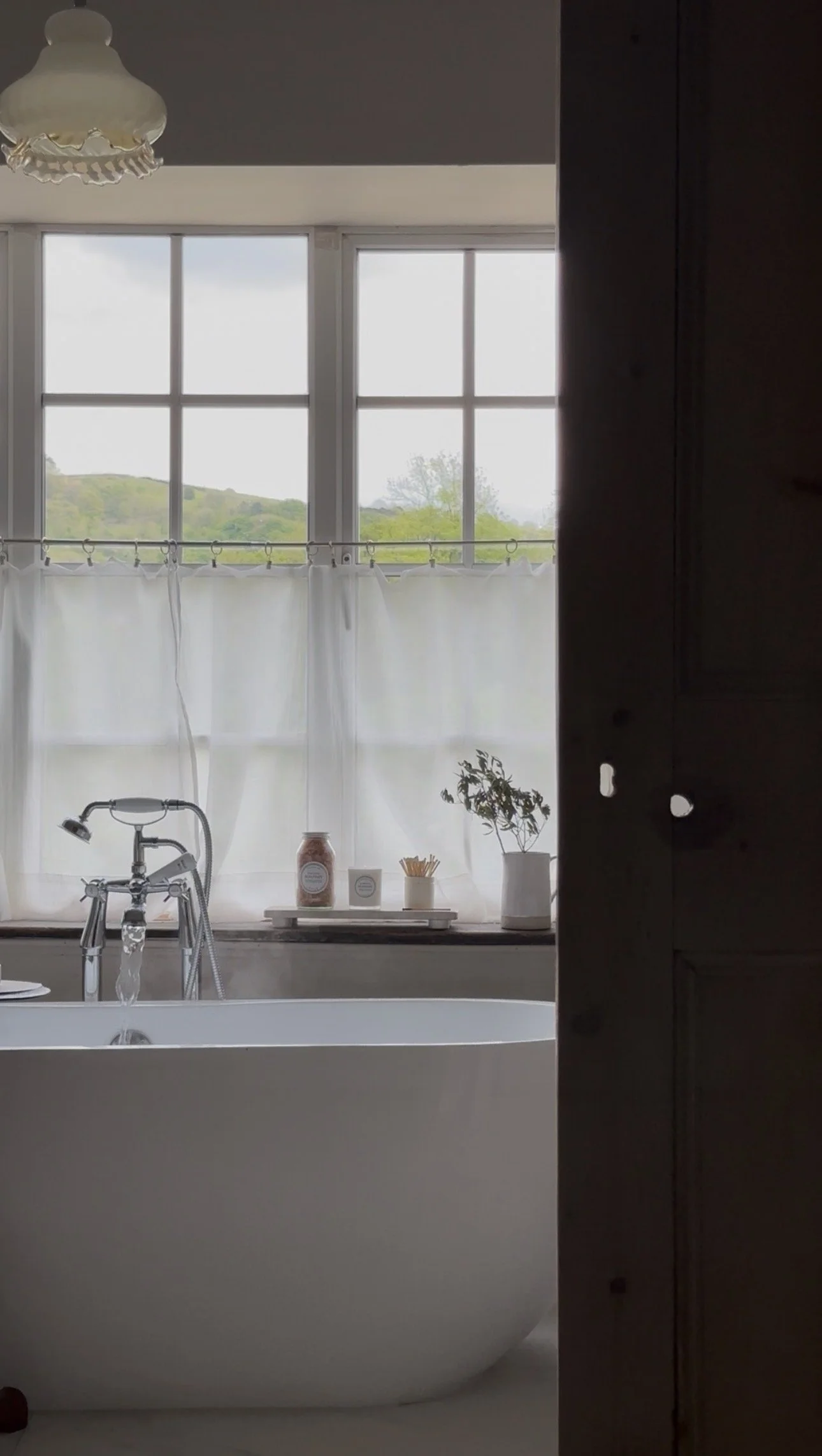 slow living bath with soapary products in the background
