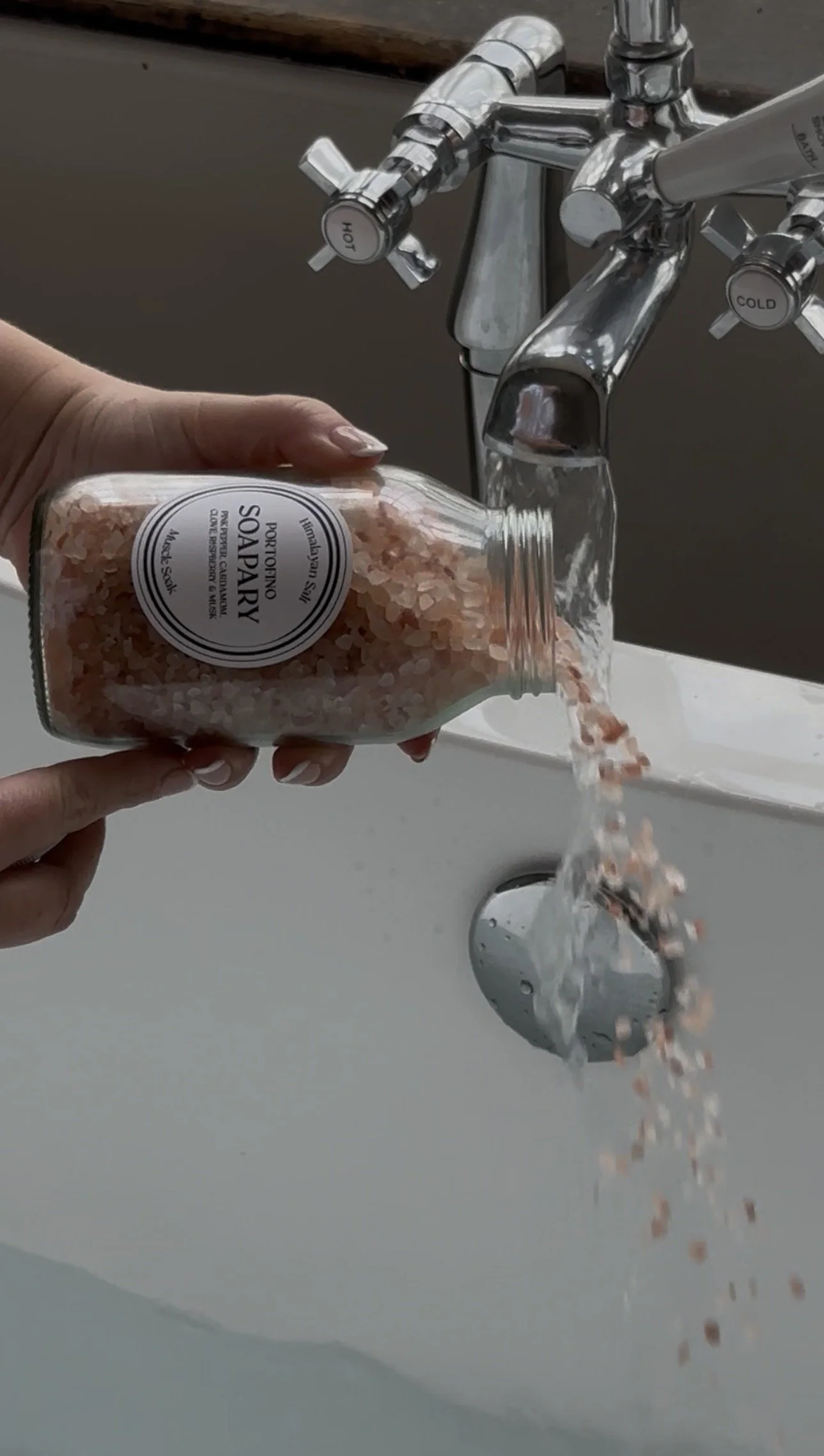 bath salts being poured into the bath
