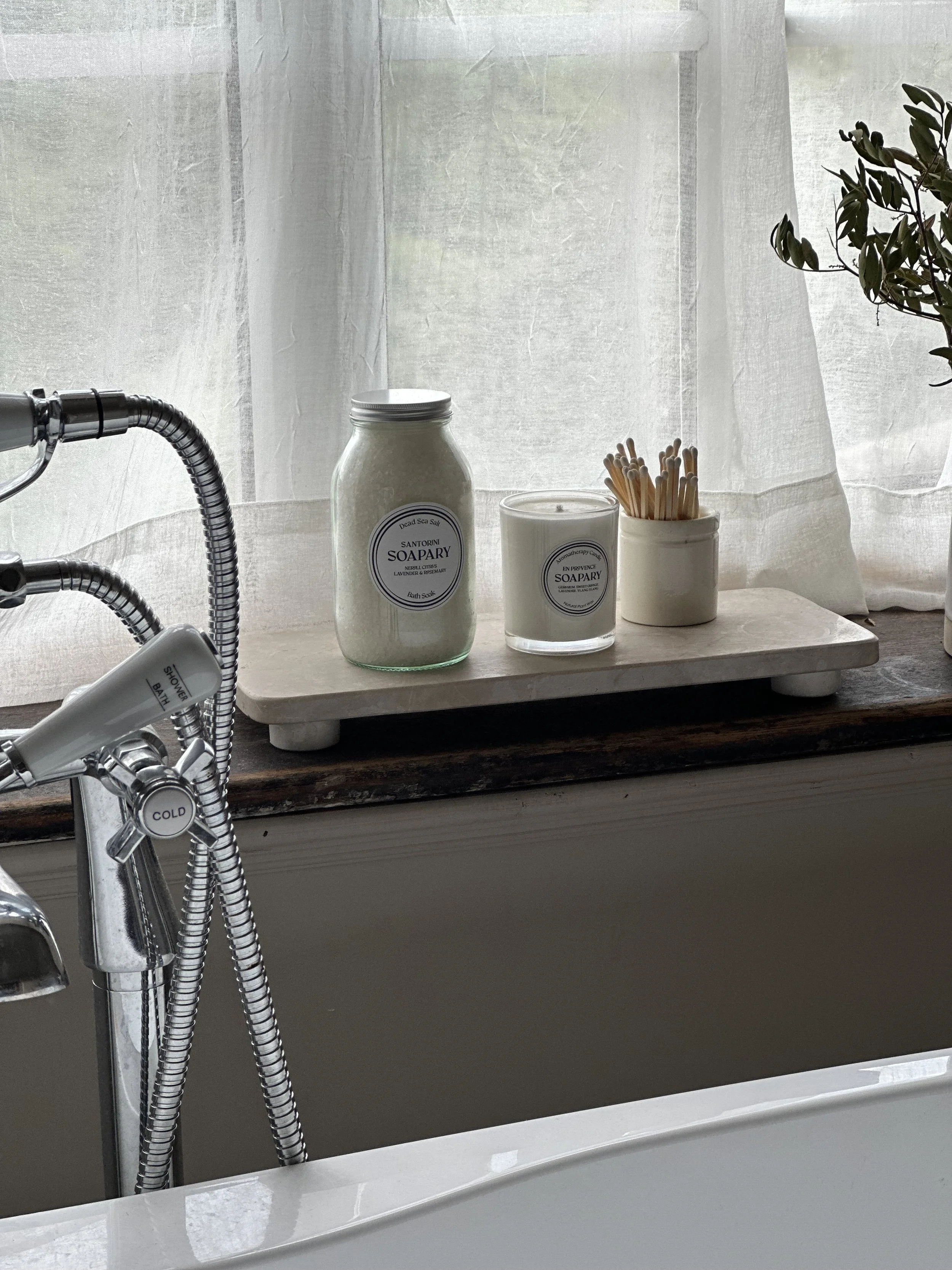 candle and bath salts in bathroom