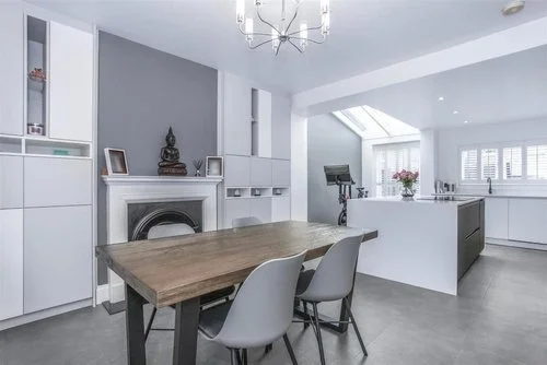 CAD image of a white open plan handleless kitchen and diner
