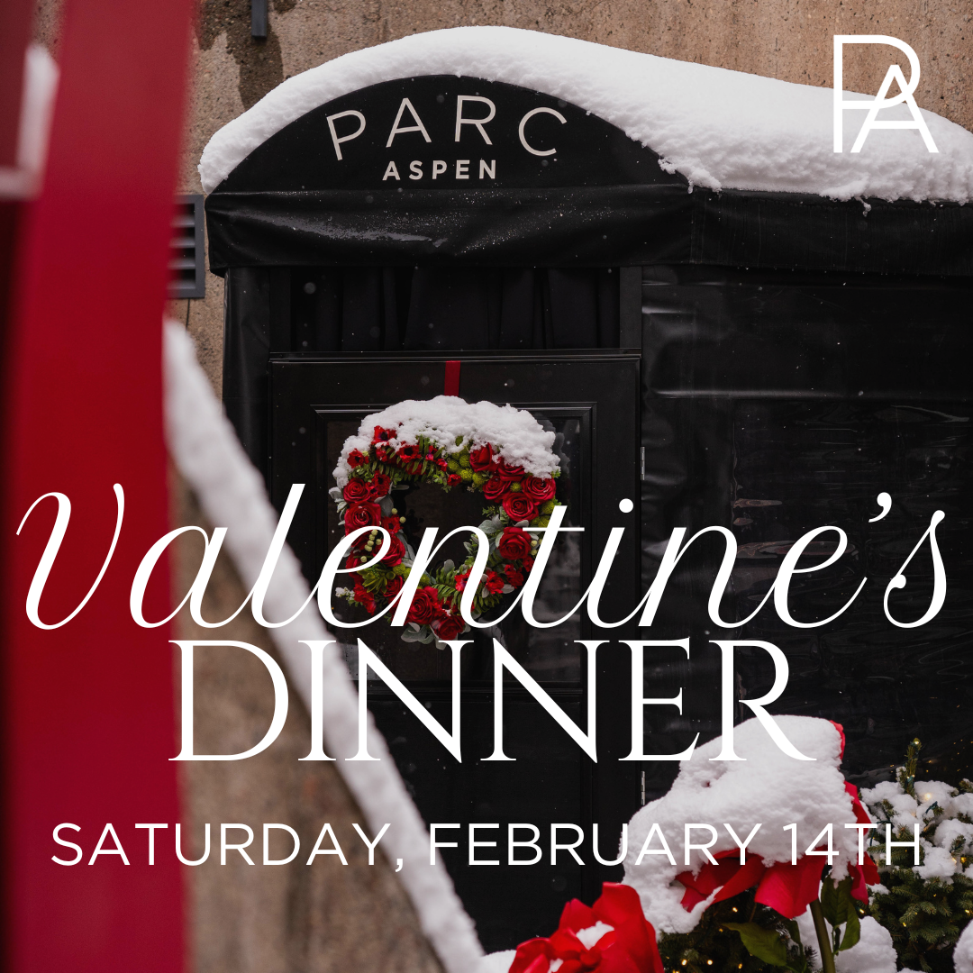 PARC Aspen Restaurant Entryway Covered in Snow with Red Floral Heart Arrangement for Valentine's Day.