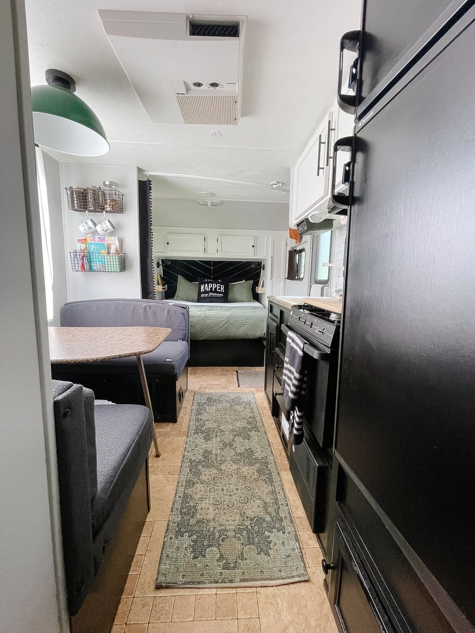 view of kitchen and bed after.jpg