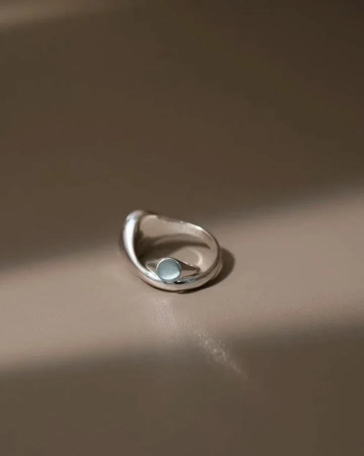 🩶 The Signet ear hoop and pendant draw inspiration from our signature signet ring, beautifully reimagined in miniature form. Each piece serves as a subtle symbol of connection, embodying enduring qualities akin to a gentle imprint of love. These tin