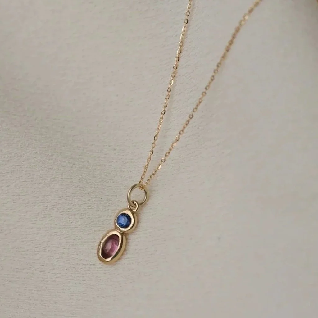 14K%2BYellow%2BGold%2BToken%2BCouplet%2BBlue%2BSapphire%2Band%2BPink%2BTourmaline%2Bby%2BBelinda%2BChang.jpg