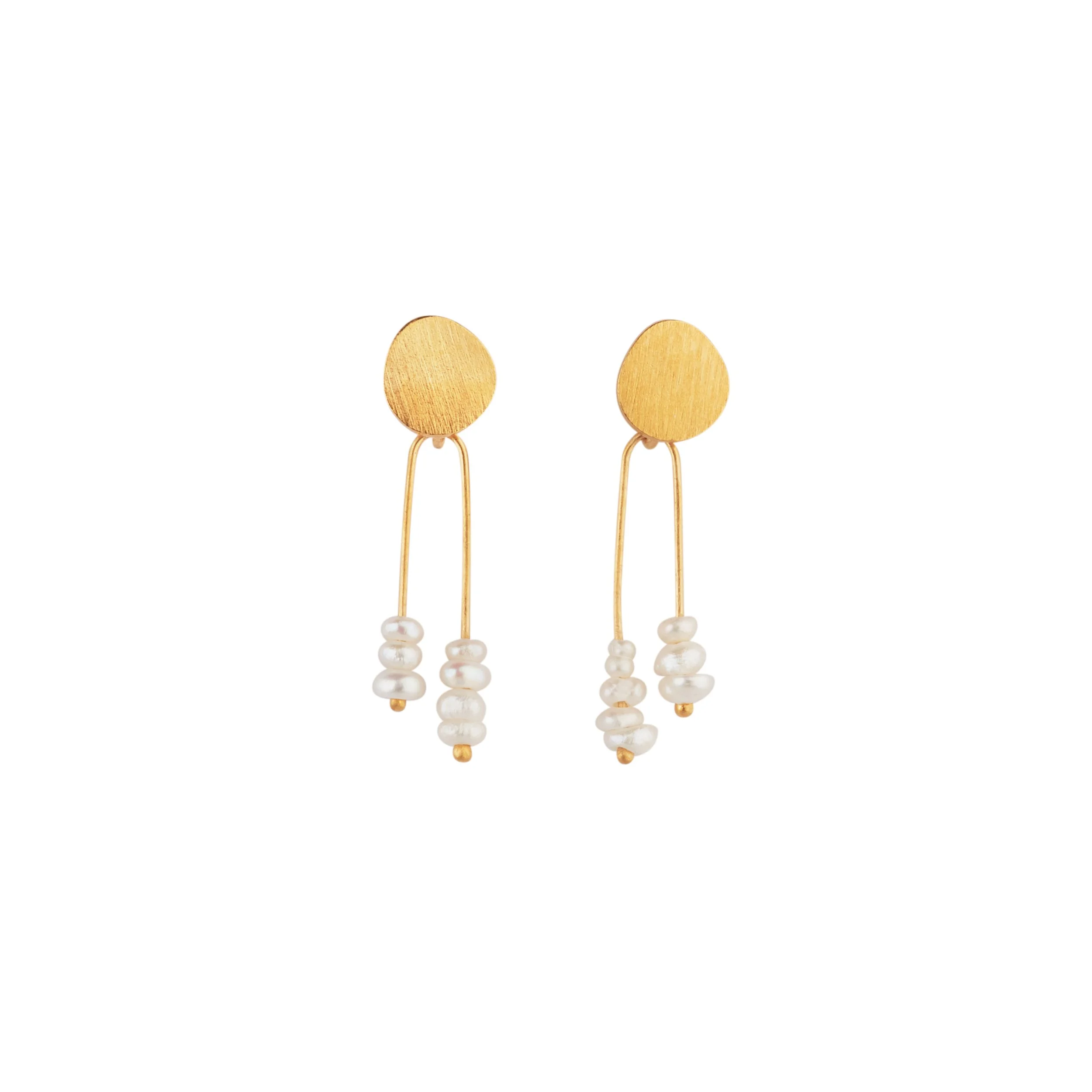   SOLAR   They are light and dancing jewels, decorated by cut patterns, between the full and the empty, light and shadow, punctuated with small pearls and narrow slats of silver.