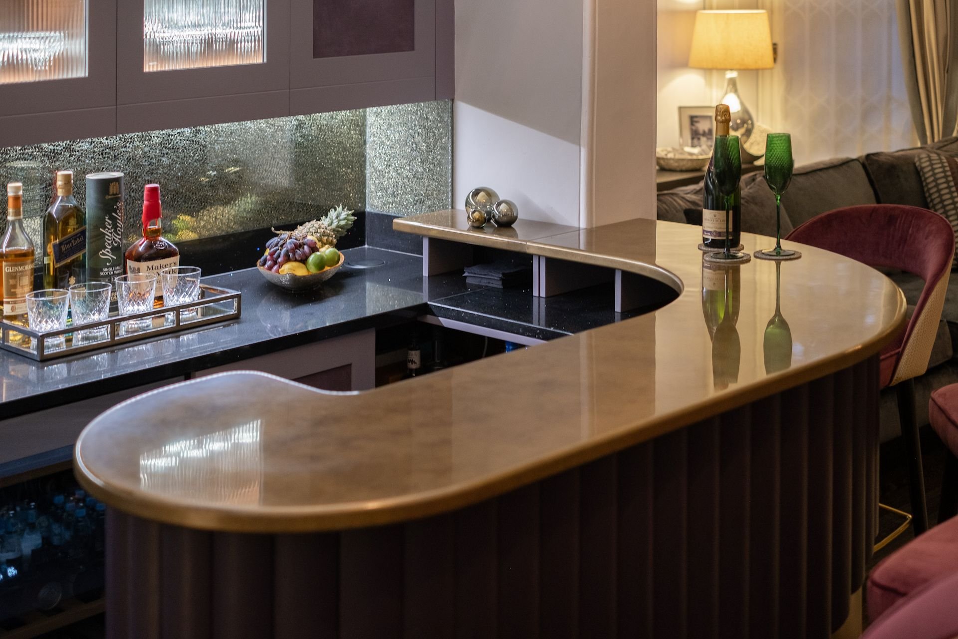 bespoke cocktail bar with metallic finish and integrated lighting