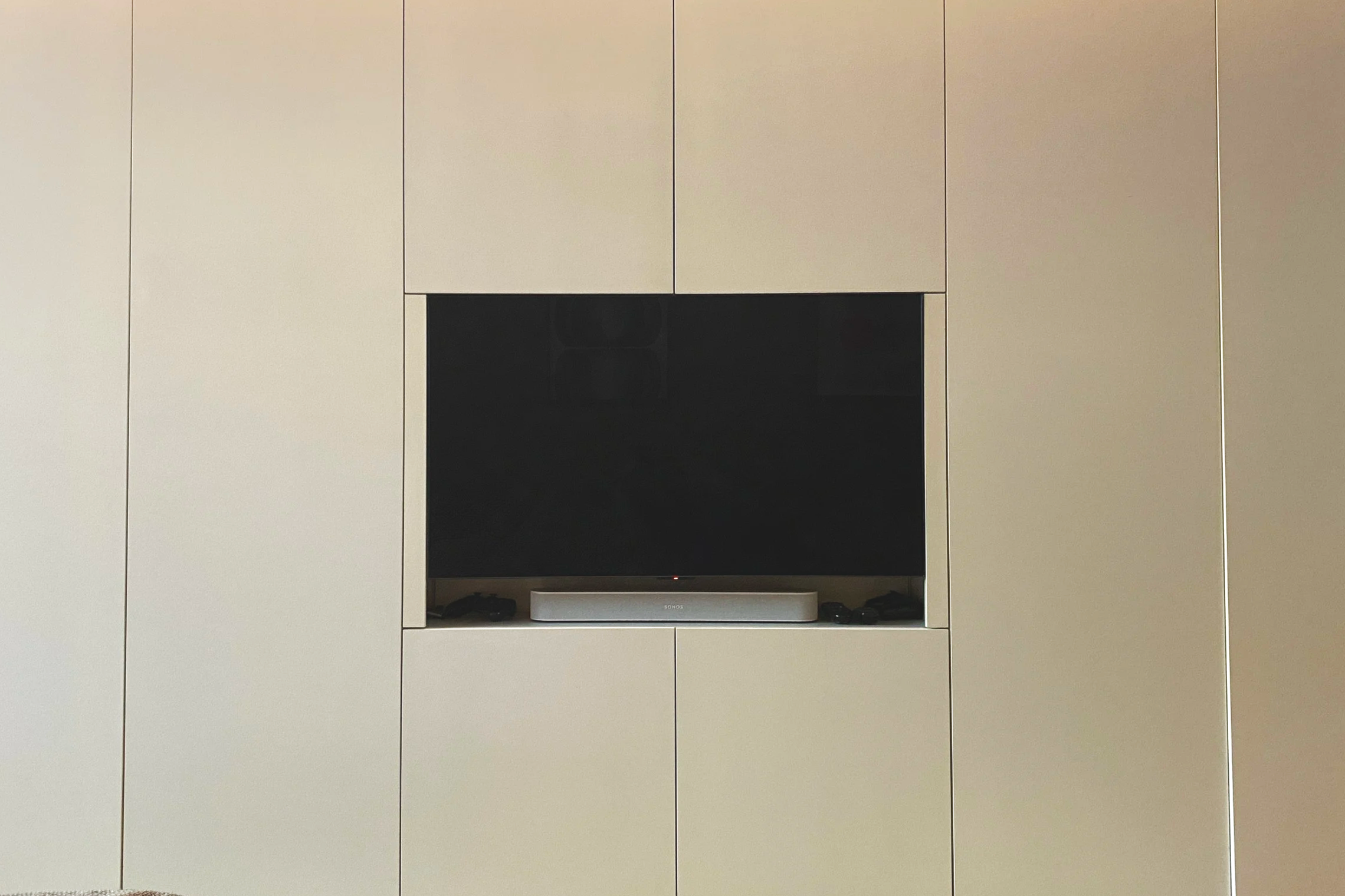 seamless storage media wall with hidden equipment