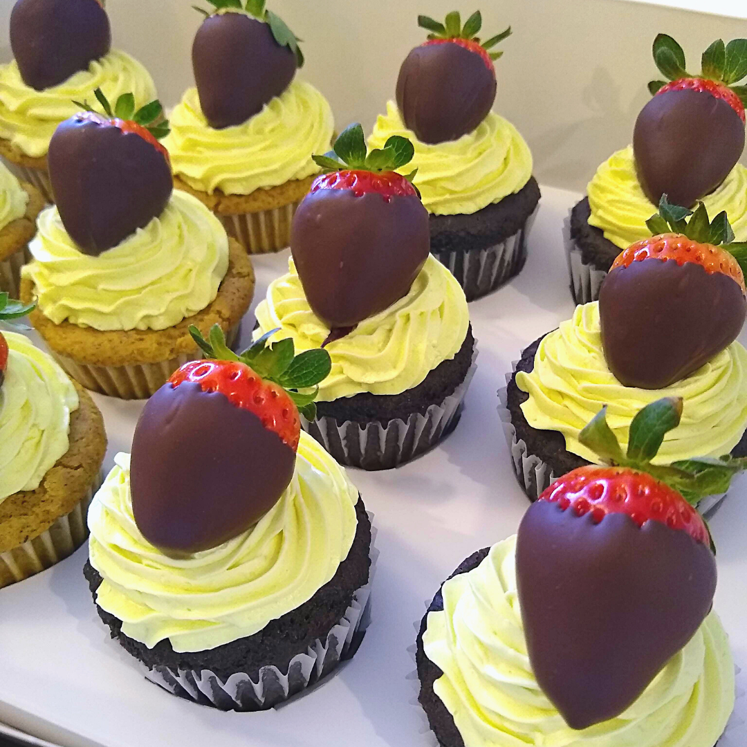 #53. Assorted cupcakes with yellow frosting and chocolate-dipped strawberries