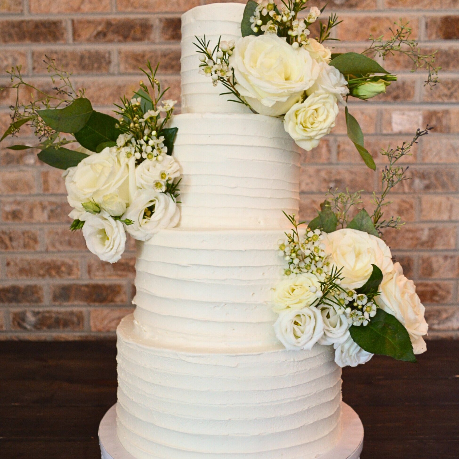#30. Four-tiered wedding cake with horizontal ribbed pattern