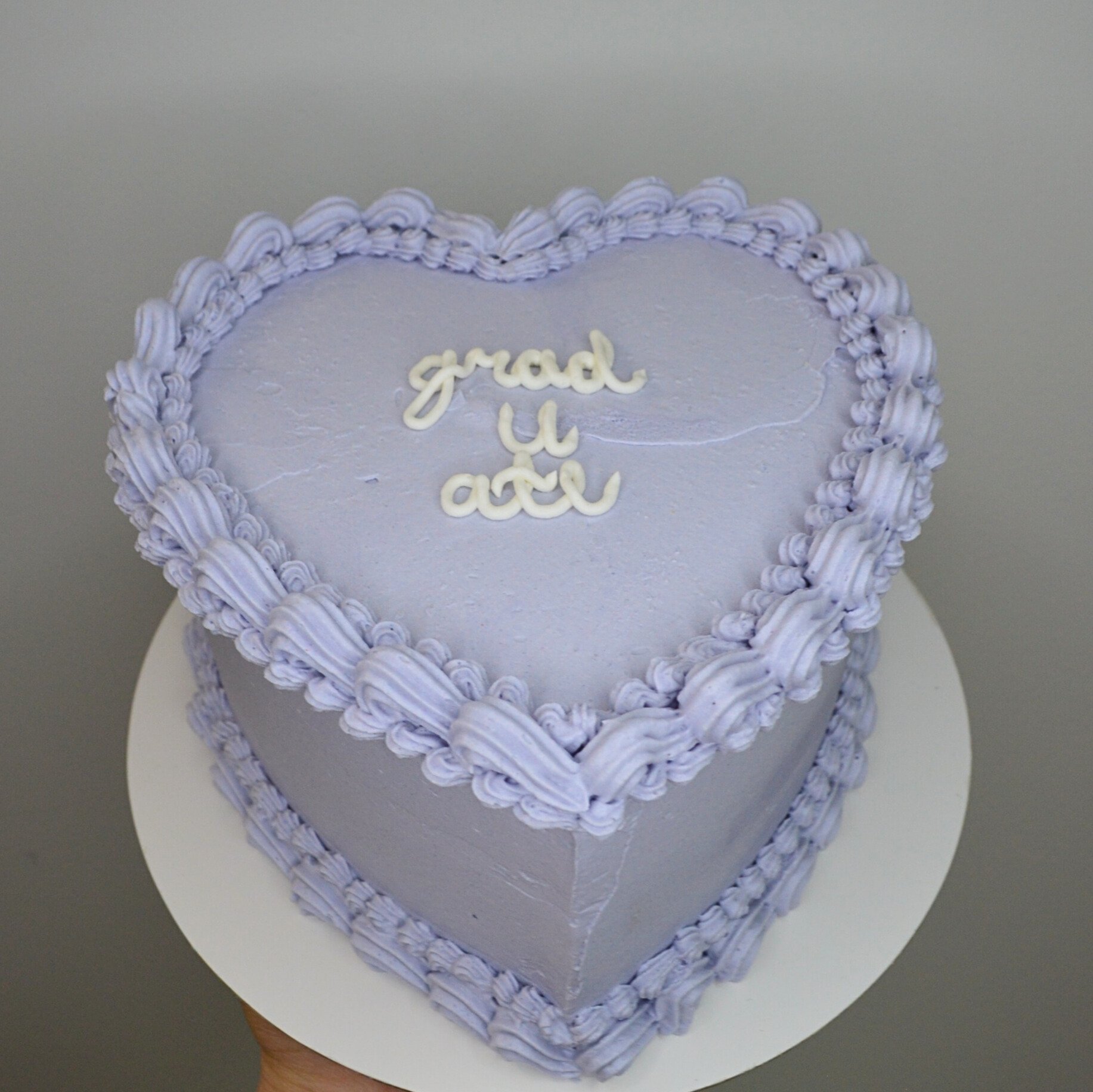 #31. Purple, heart-shaped, partial-vintage style cake.