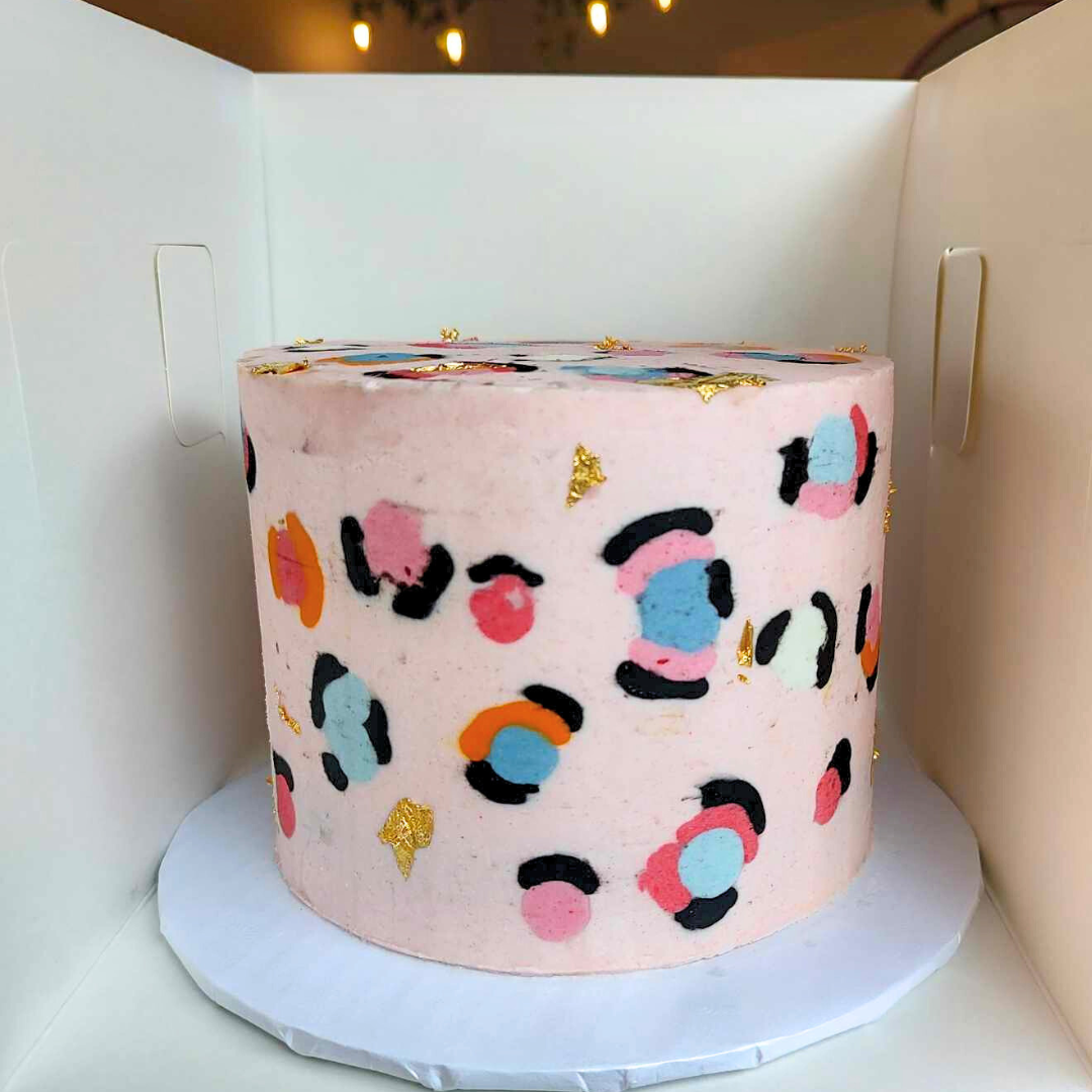 #12. This is a 6" round, 3-layer multi-colored leopard print cake with the leopard print flush against the cake and edible gold foil.