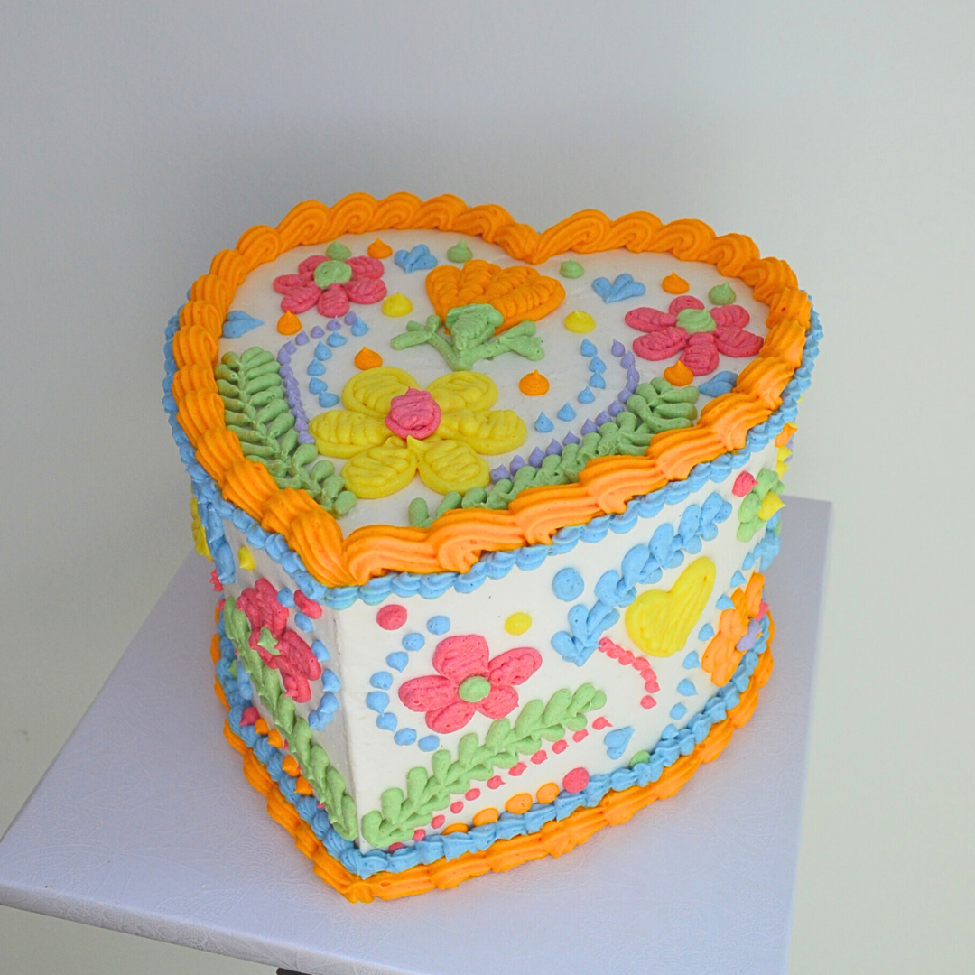 #2. This is an 8" heart-shaped, 3-layer Mexican embroidery cake.